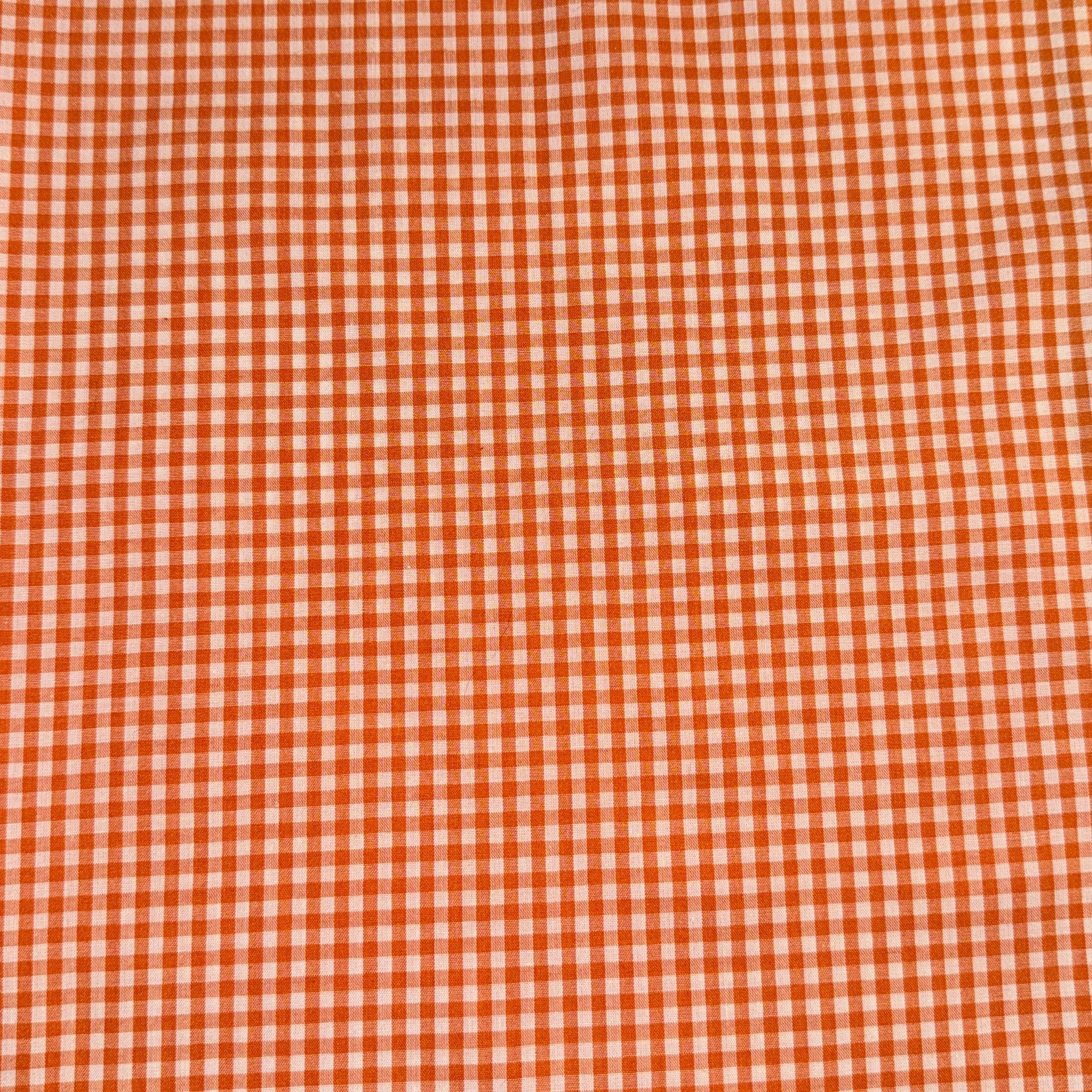 Close-up of a red and white checkered fabric pattern.