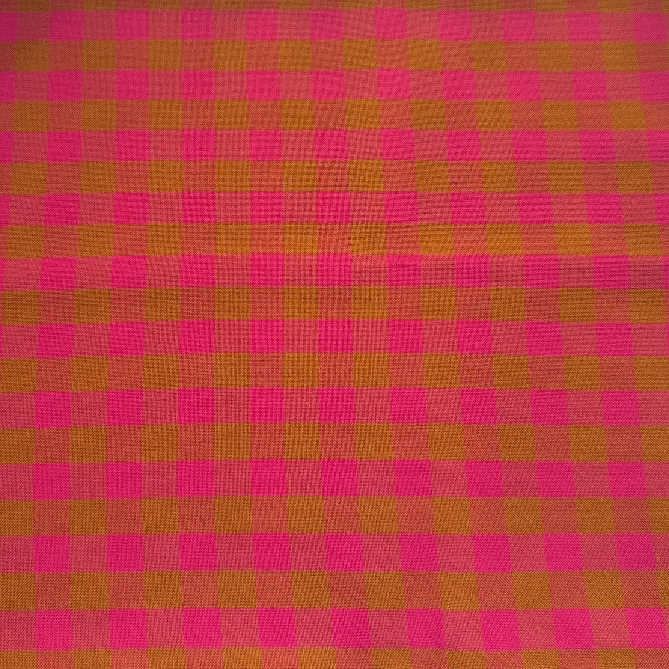Close-up of pink and orange checkered fabric pattern.