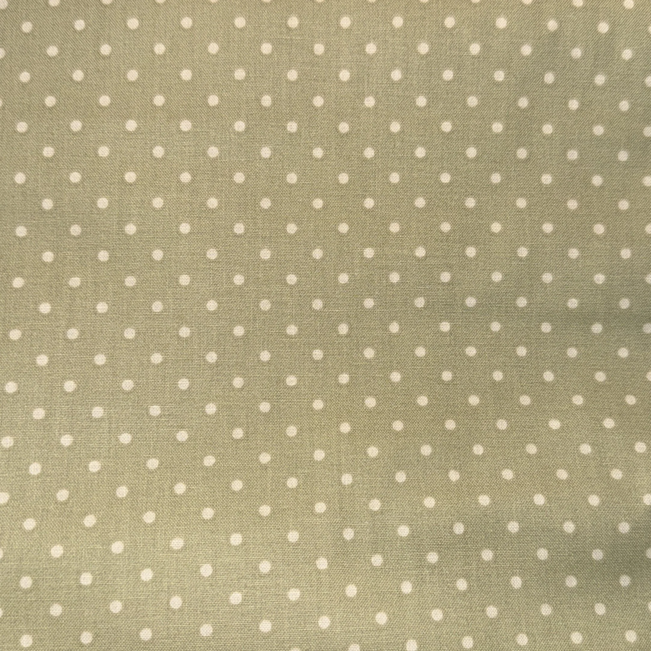 Light green fabric with a pattern of evenly spaced small white polka dots.
