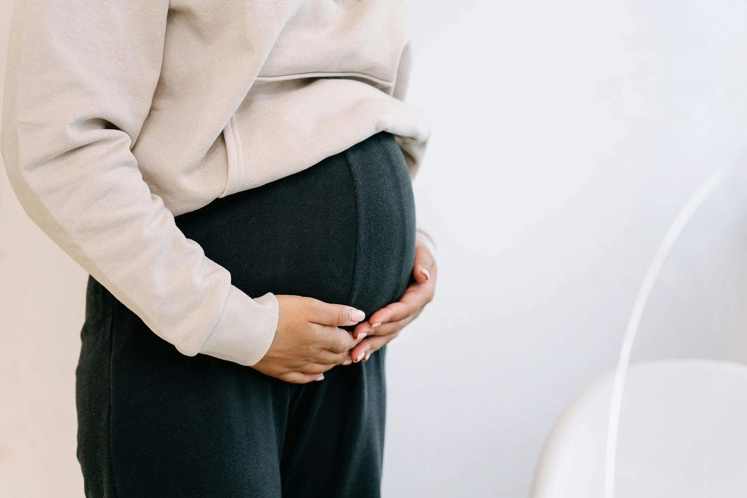 Closeup of clothed pregnant midsection