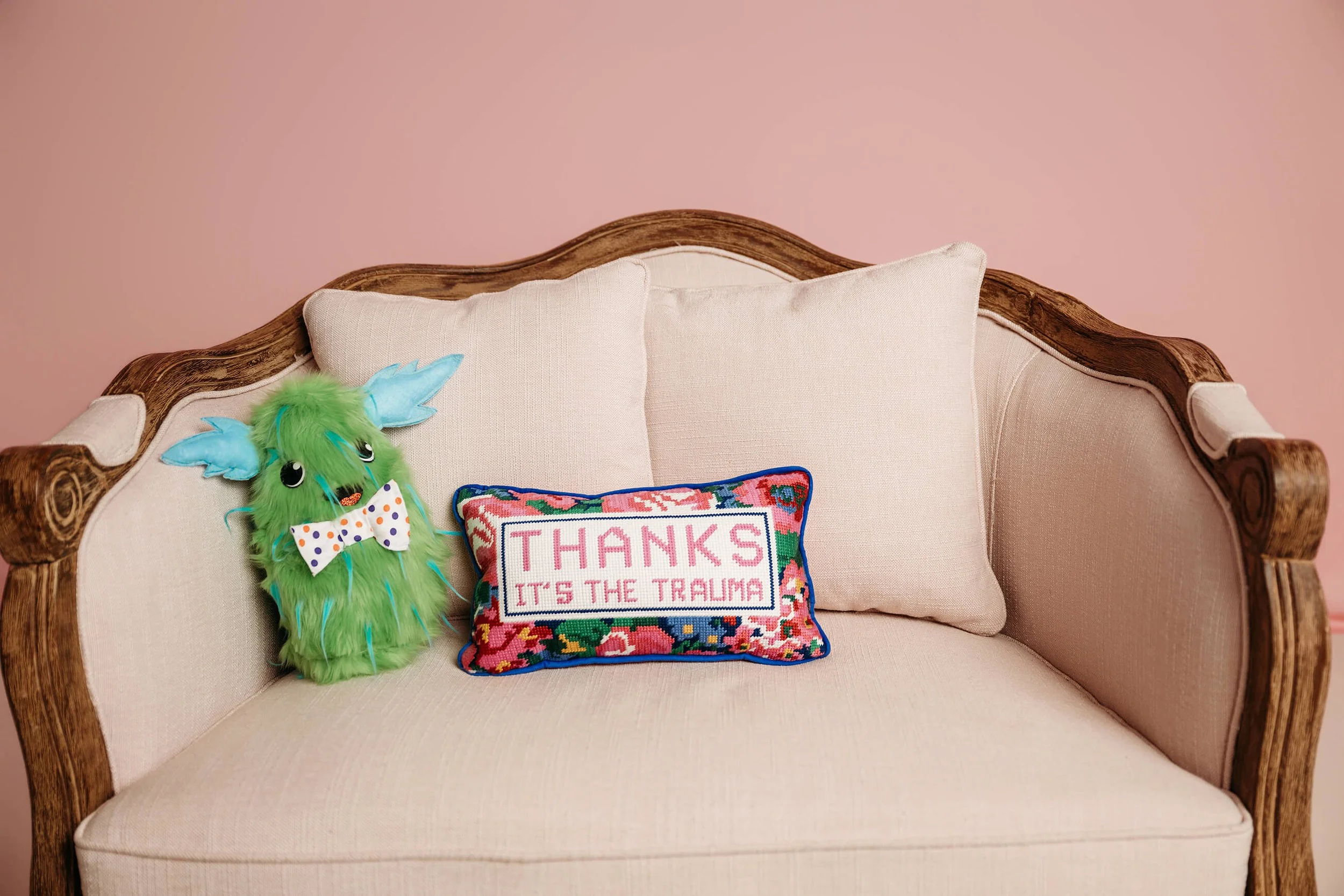 Couch with decorative mental health-themed pillows