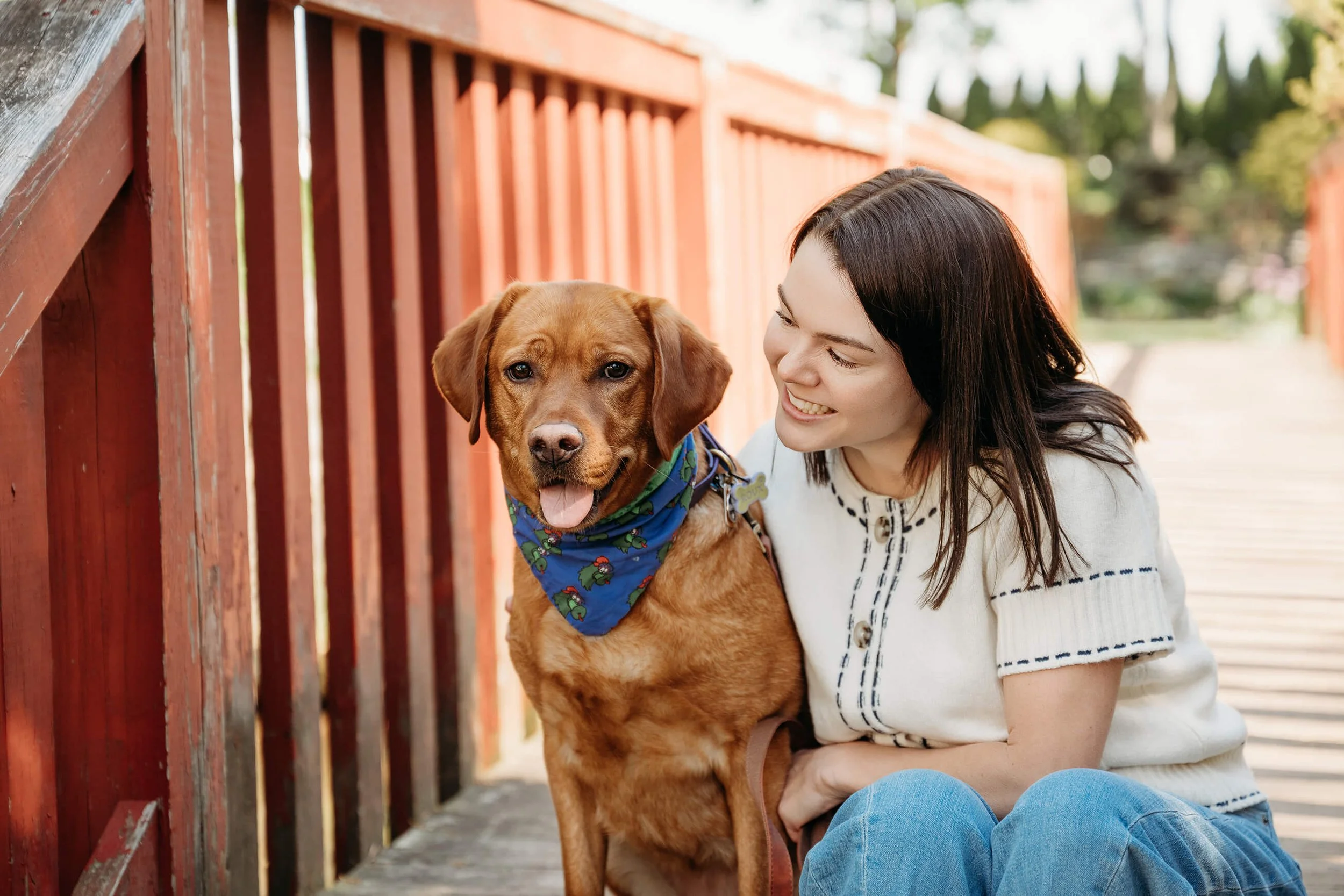 Dr. Hillary Ammon sitting with family dog