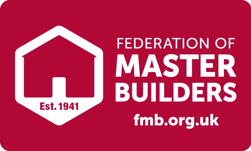 Red banner with white and pink logo of a house shape, text 'Est. 1941', and organization name 'Federation of Master Builders', website 'fmb.org.uk'.