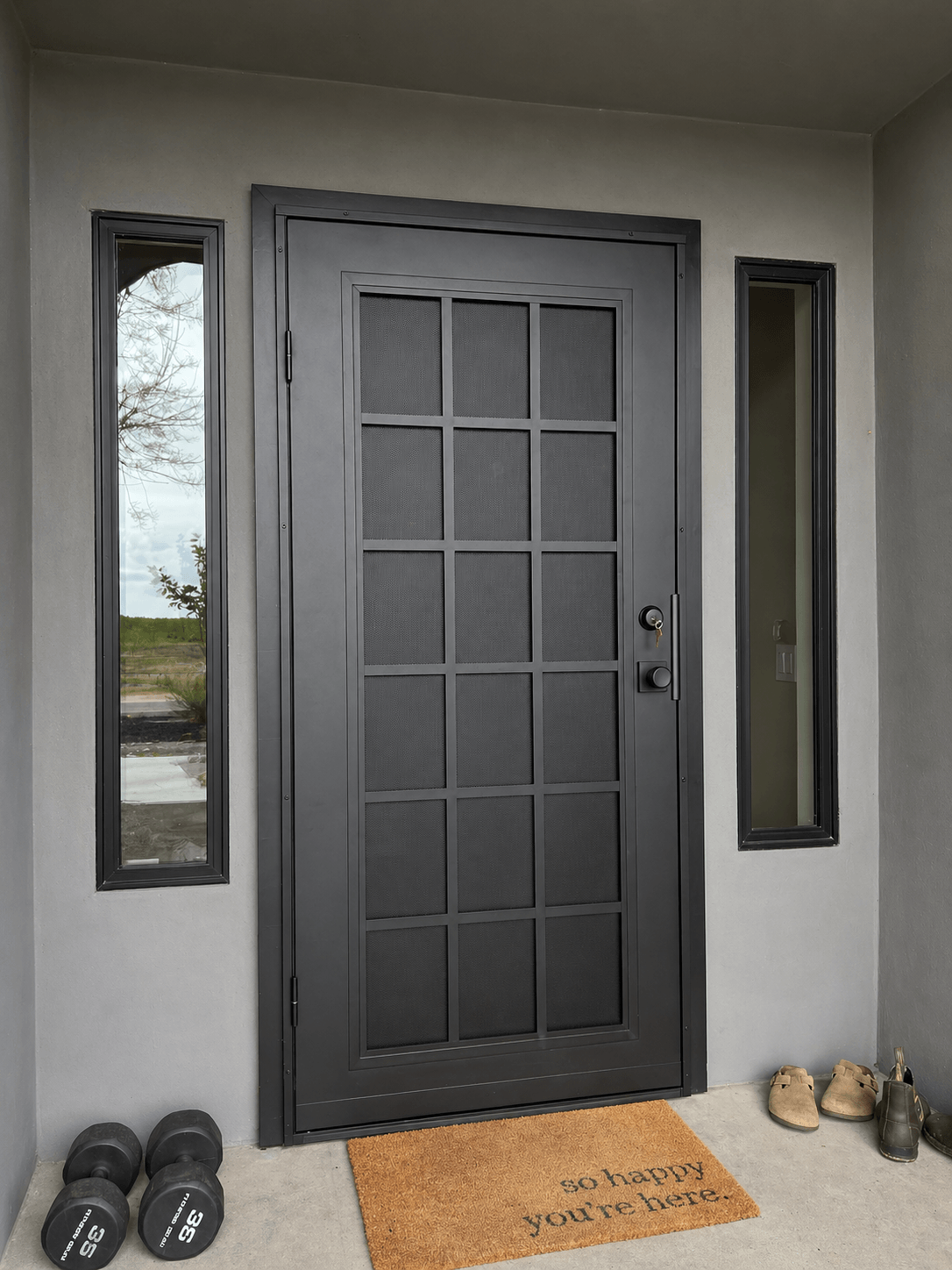 Black security door professionally installed on a residential front entryway in Stockton, California.