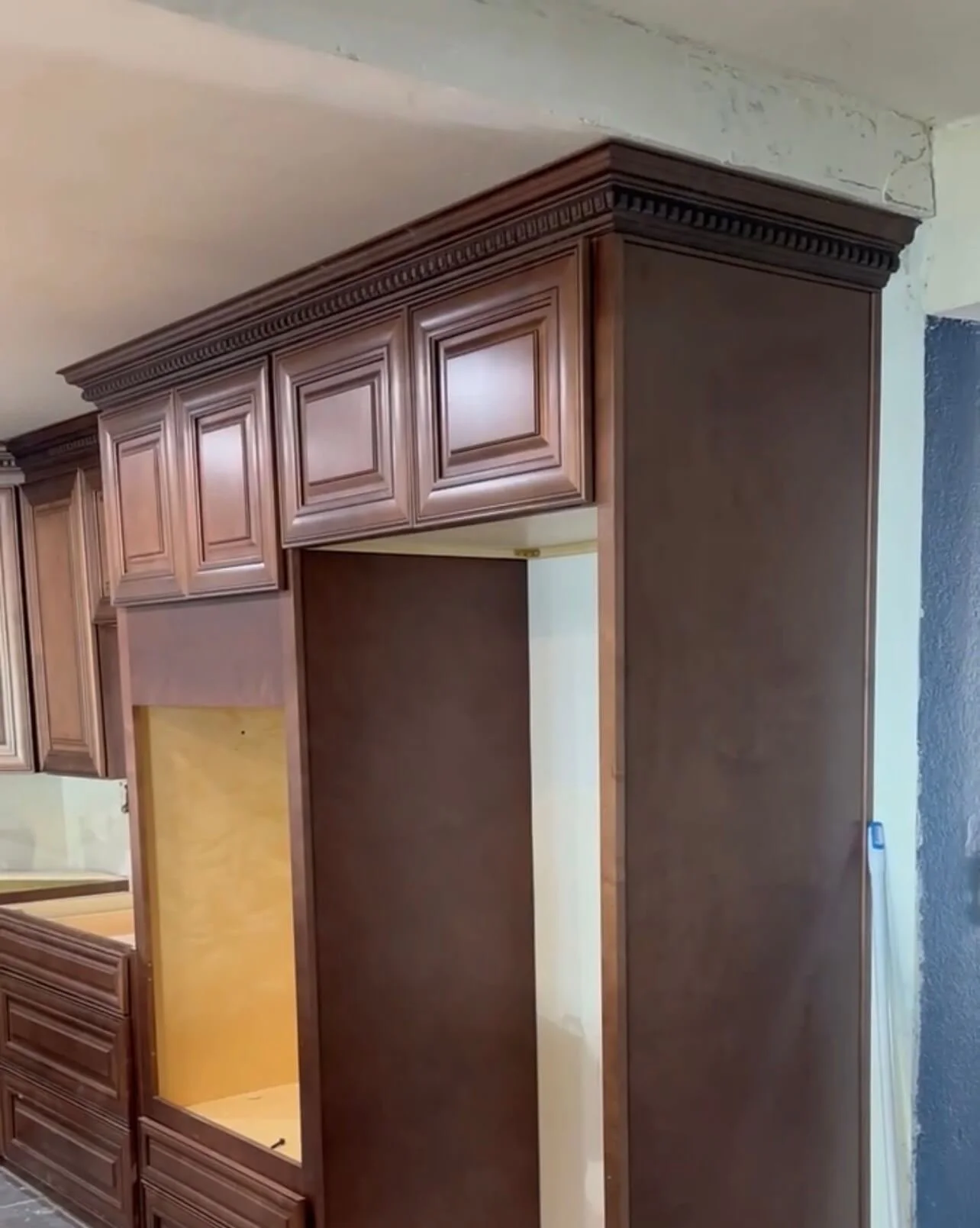 Custom kitchen cabinet installation with decorative crown molding and finish carpentry by All About Carpentry Inc. in Stockton, California.