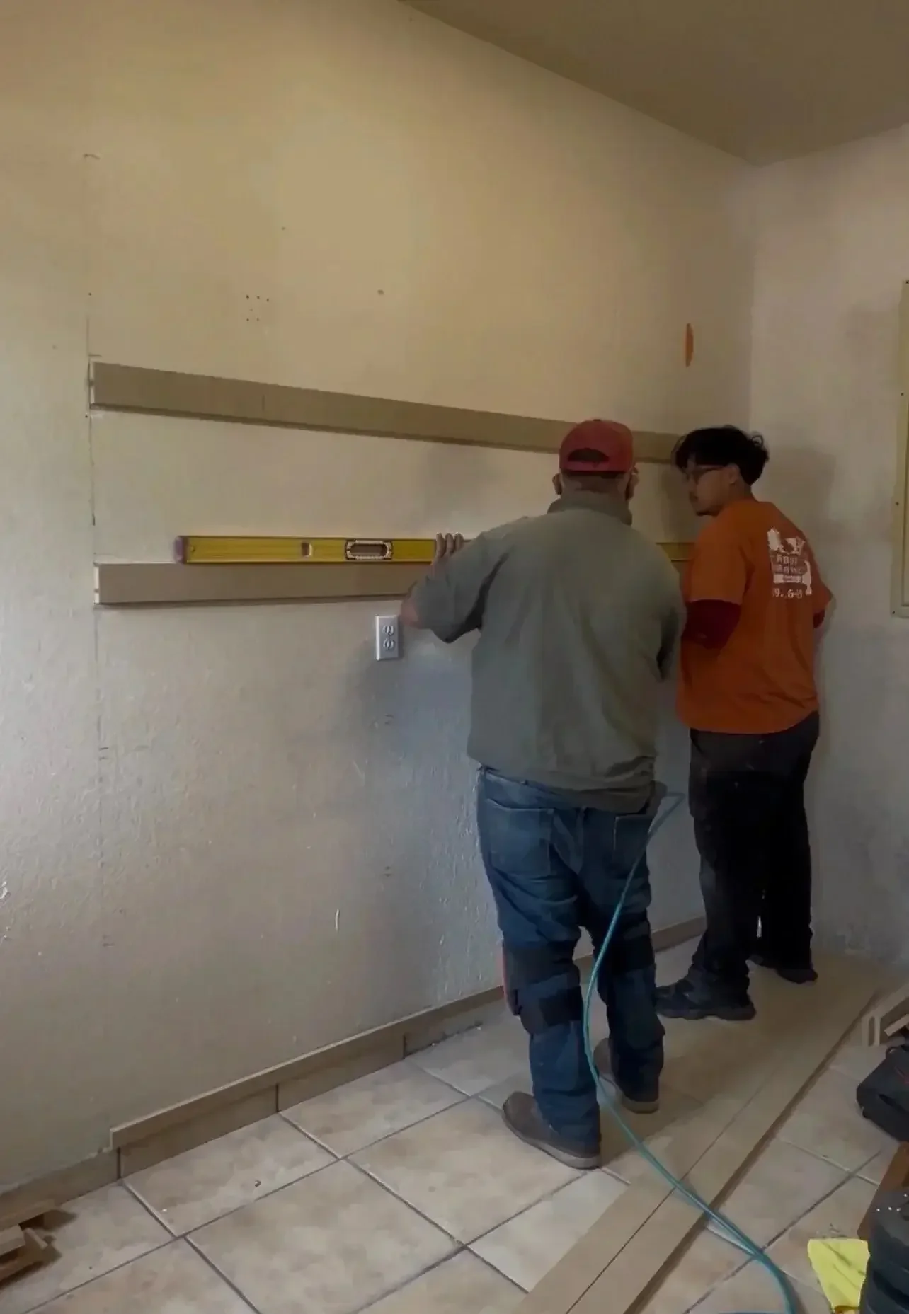 Professional installation of custom floating shelves during a residential finish carpentry project in Stockton, California.