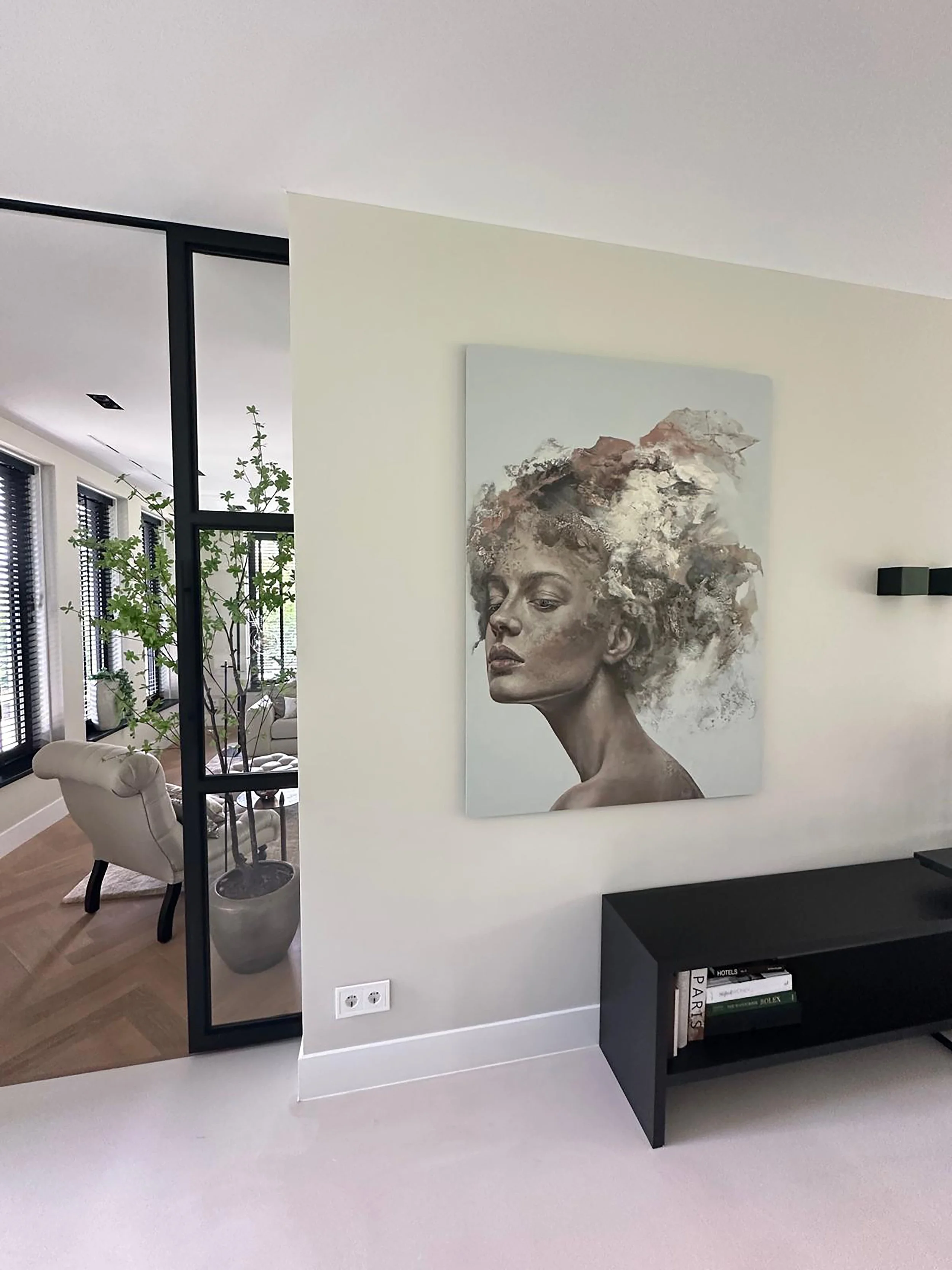 Contemporary abstract portrait of a female figure by Iris Schreven, soft tones, realistic features, layered textures and ethereal composition, in room of collector