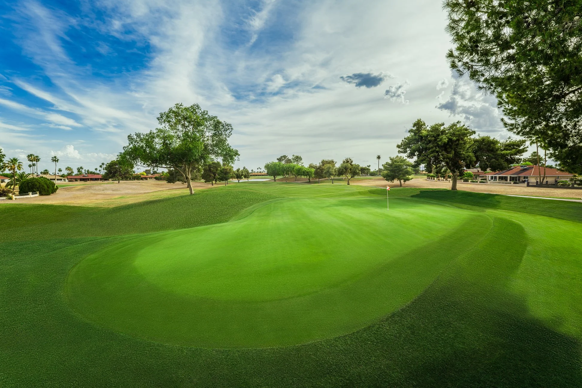 View of the putting green on the 3rd hole of the golf course at Briarwood Country Club in Sun City West Arizona.