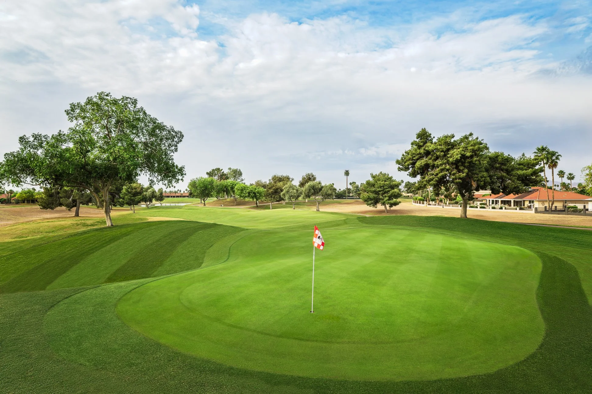 View of the putting green on the 3rd hole of the golf course at Briarwood Country Club in Sun City West Arizona.