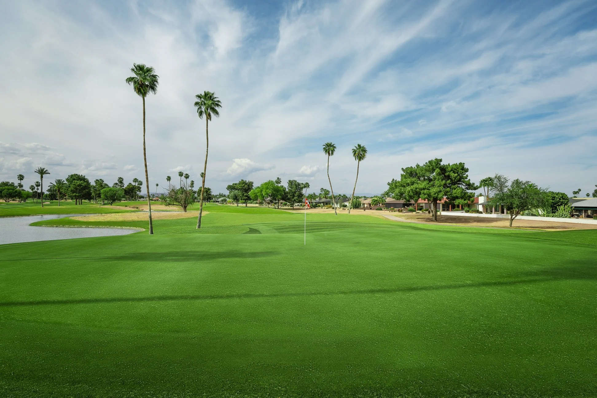 View of the fairway and lake on the 13th hole at Briarwood Country Club in Sun City West, Arizona.