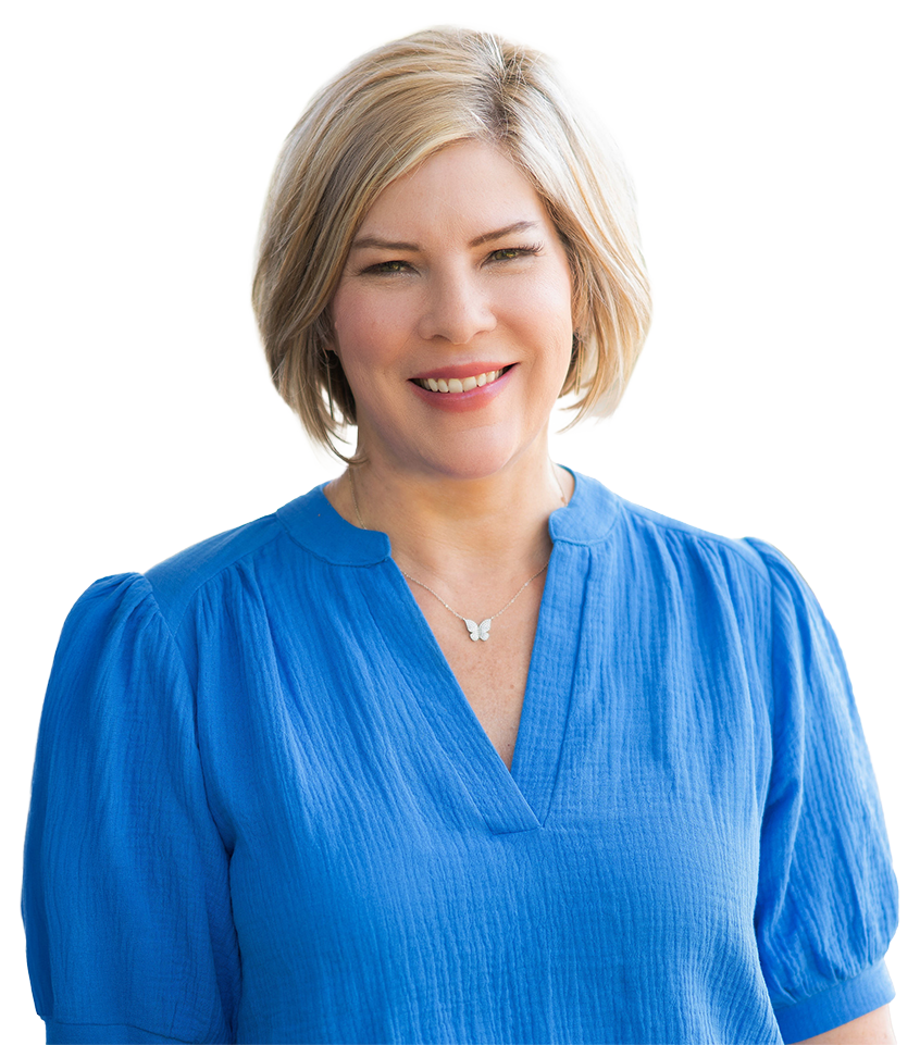 A smiling woman with short blonde hair wearing a blue blouse and a butterfly necklace