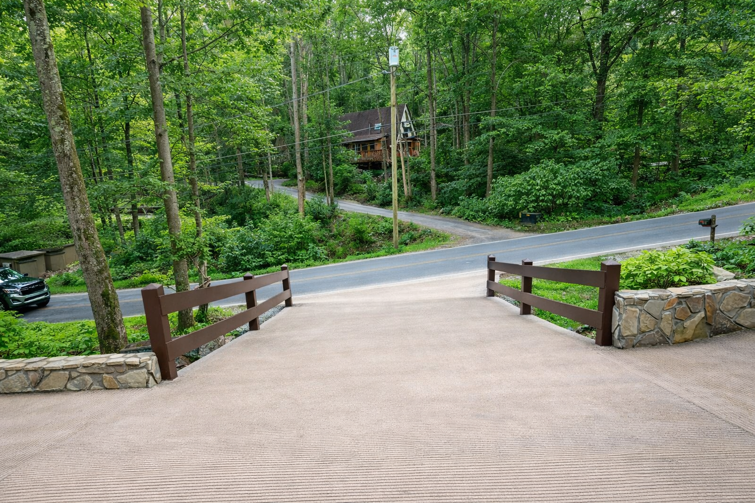 Residential road and site work in Gatlinburg TN with grading and access road through wooded area