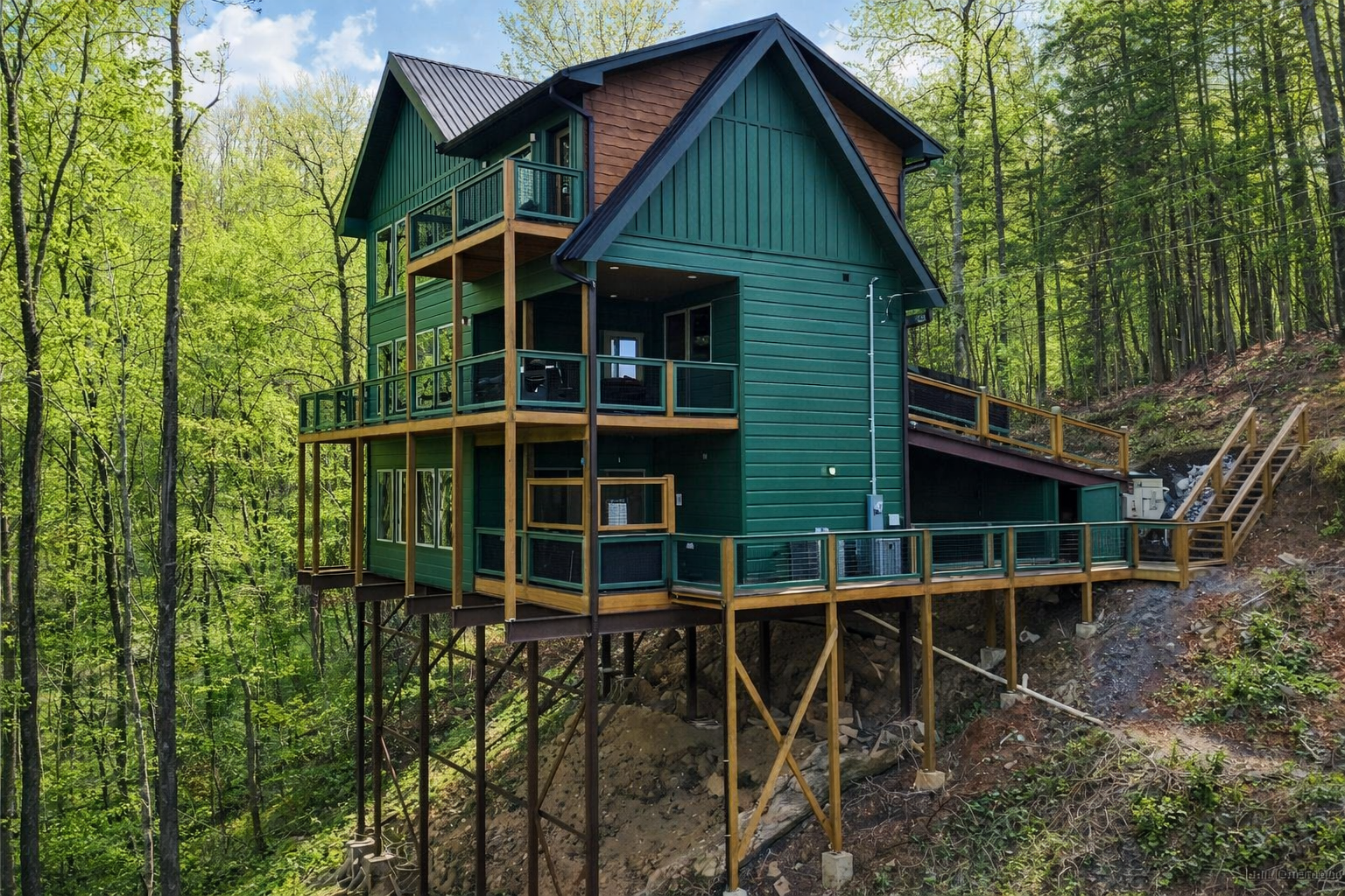 Elevated custom home supported by structural steel framework in East Tennessee