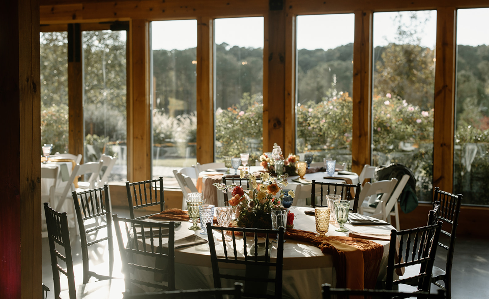 South Asian wedding reception tables with views of NC mountains