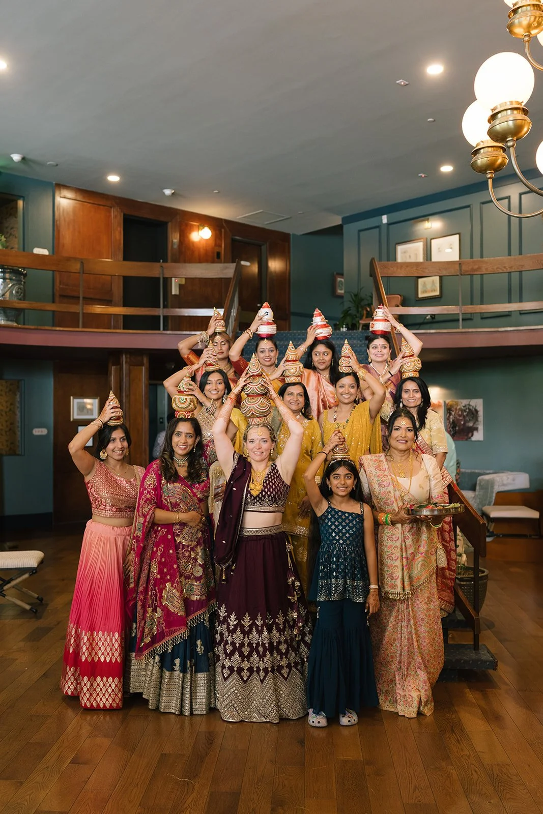South Asian wedding party posing in traditional garb