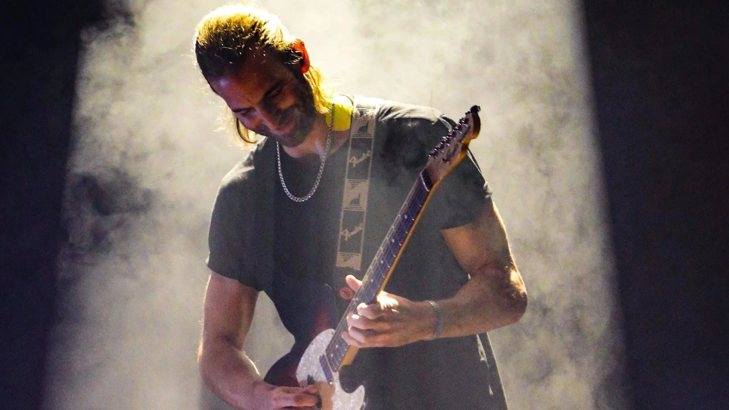 Guitarist Jessy Hay in concert during world tour