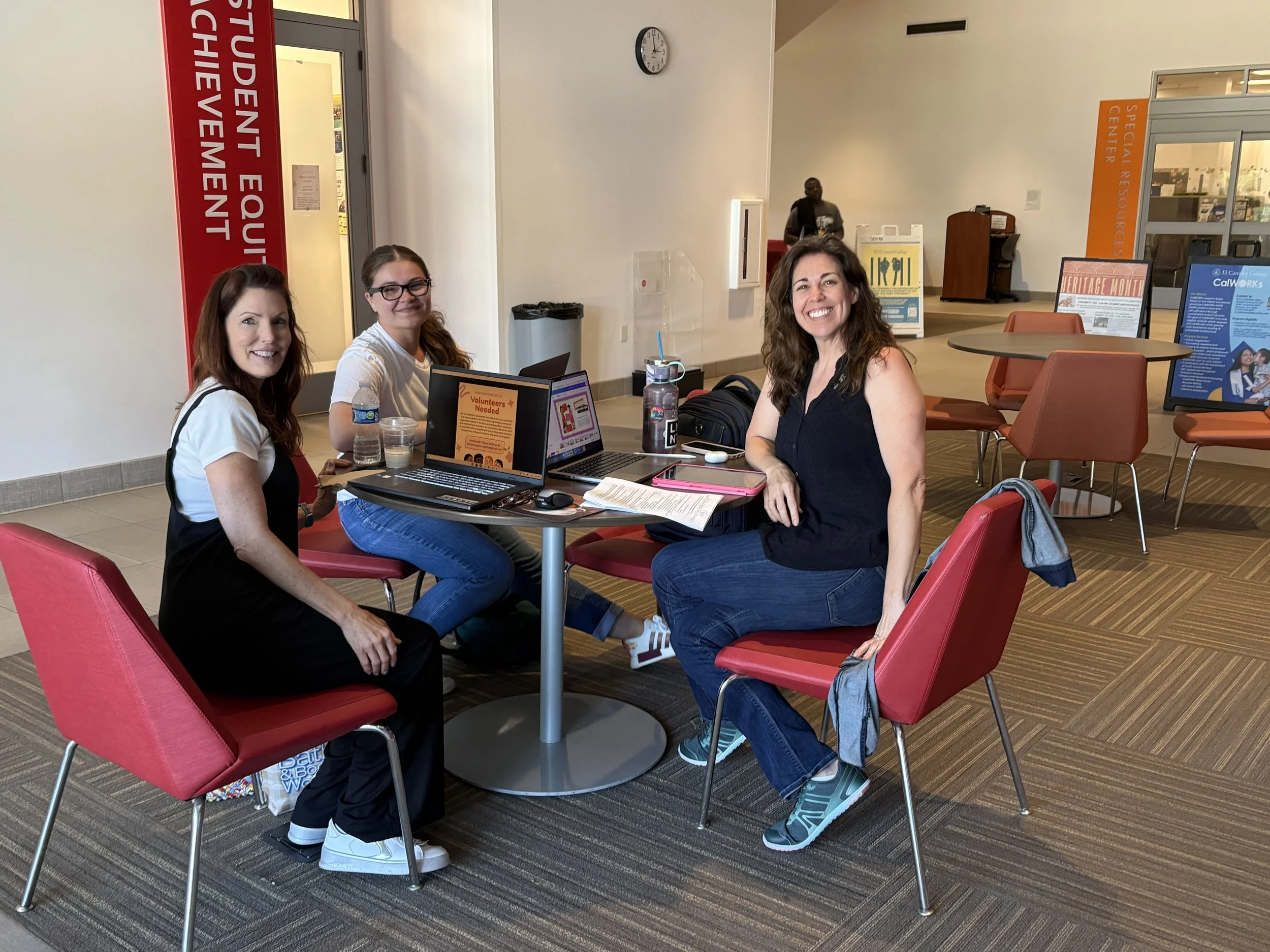 Hillary Wilson, Anisa Alamia, Taylor Phillips around a table at El Camino College