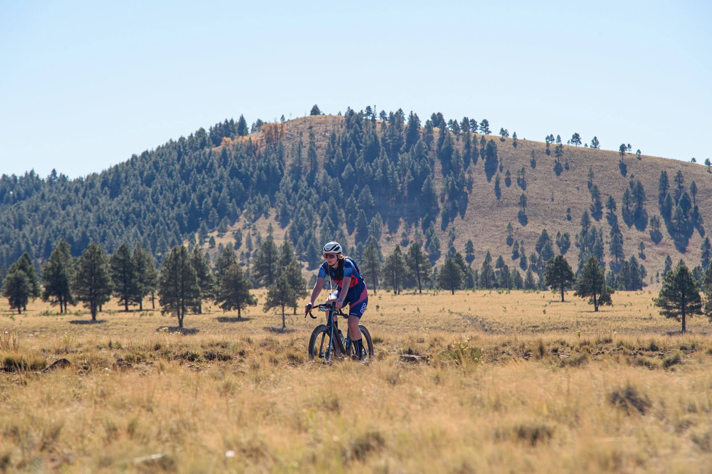 bike rider in the field riding gravel