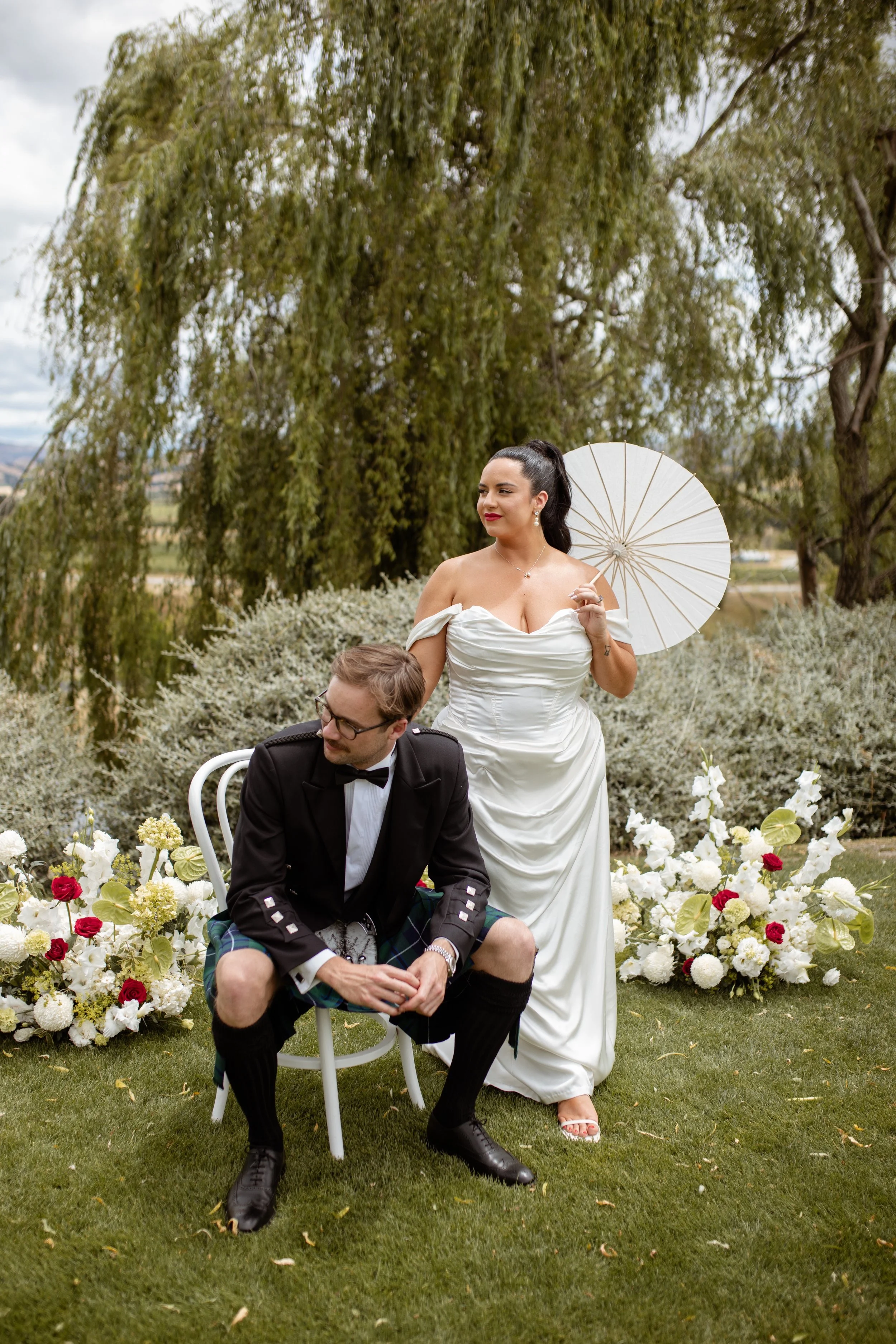 Red white and green wedding ceremony flowers