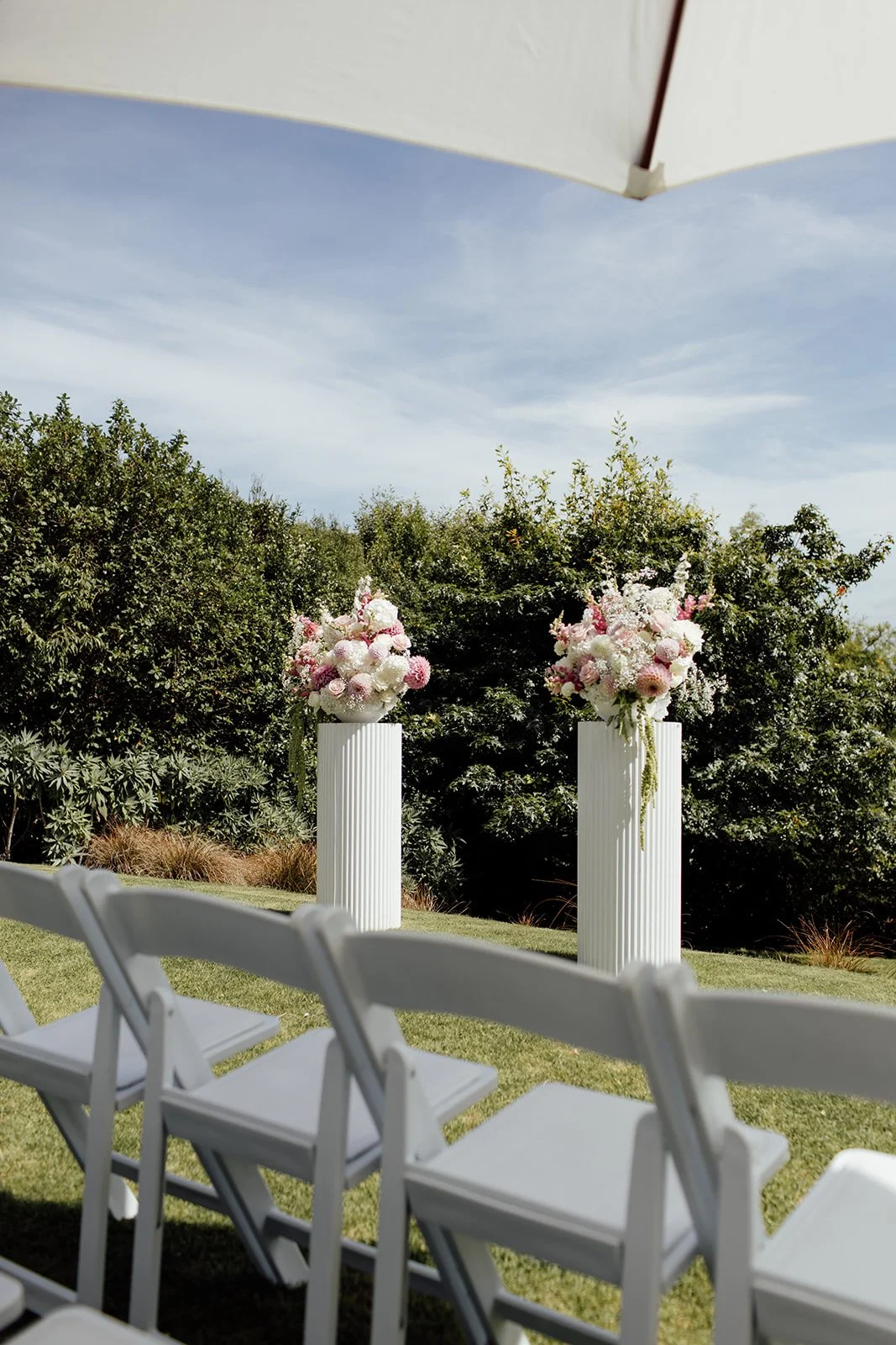 Pink and white wedding plinth flowers