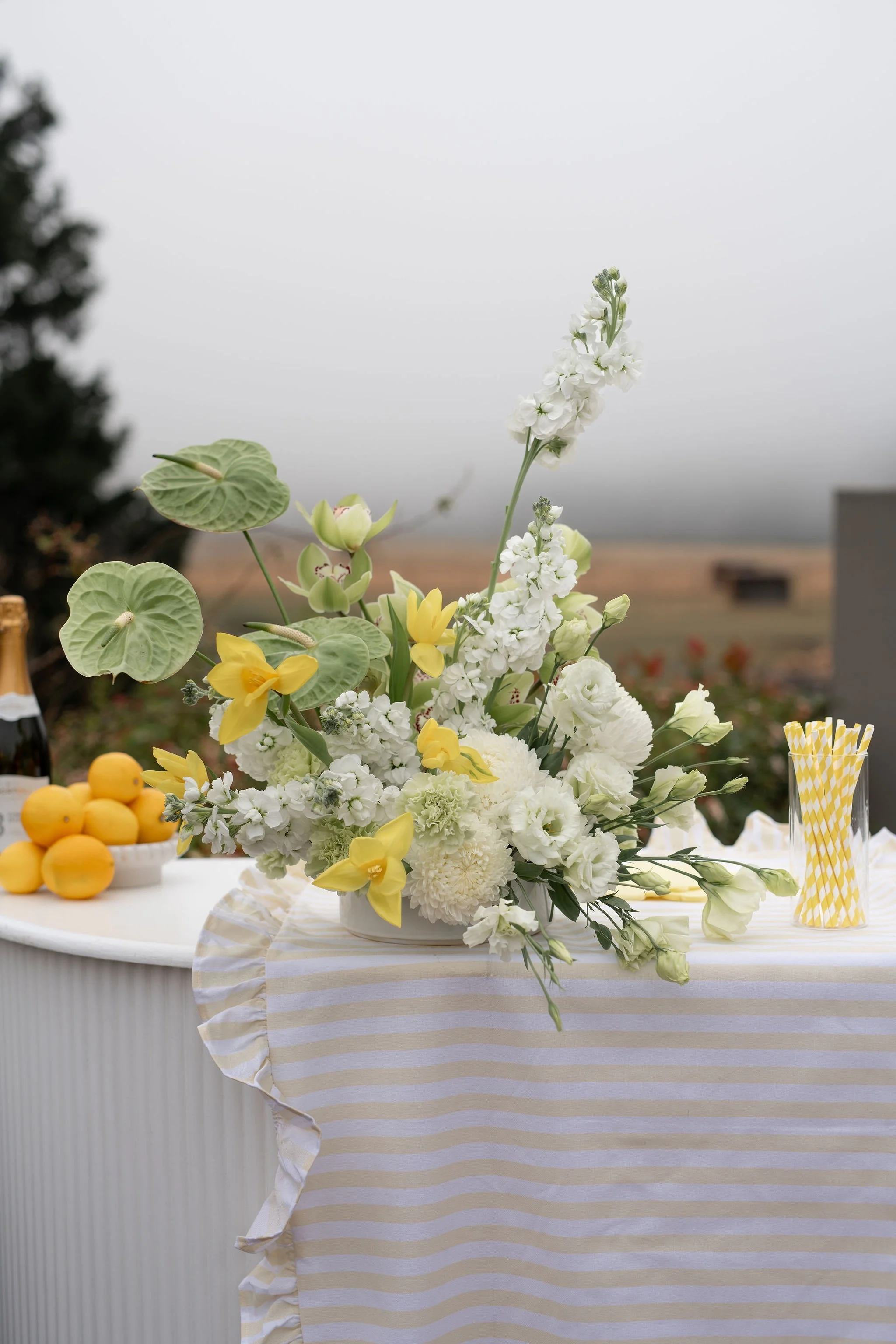 citrus wedding flowers bar arrangement