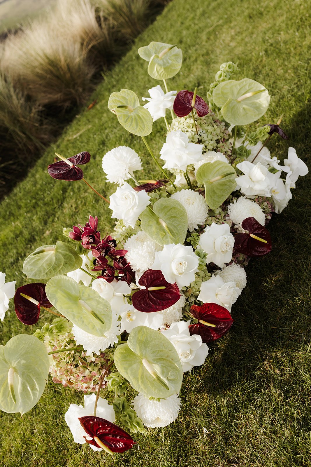 Red white and green ceremony flowers