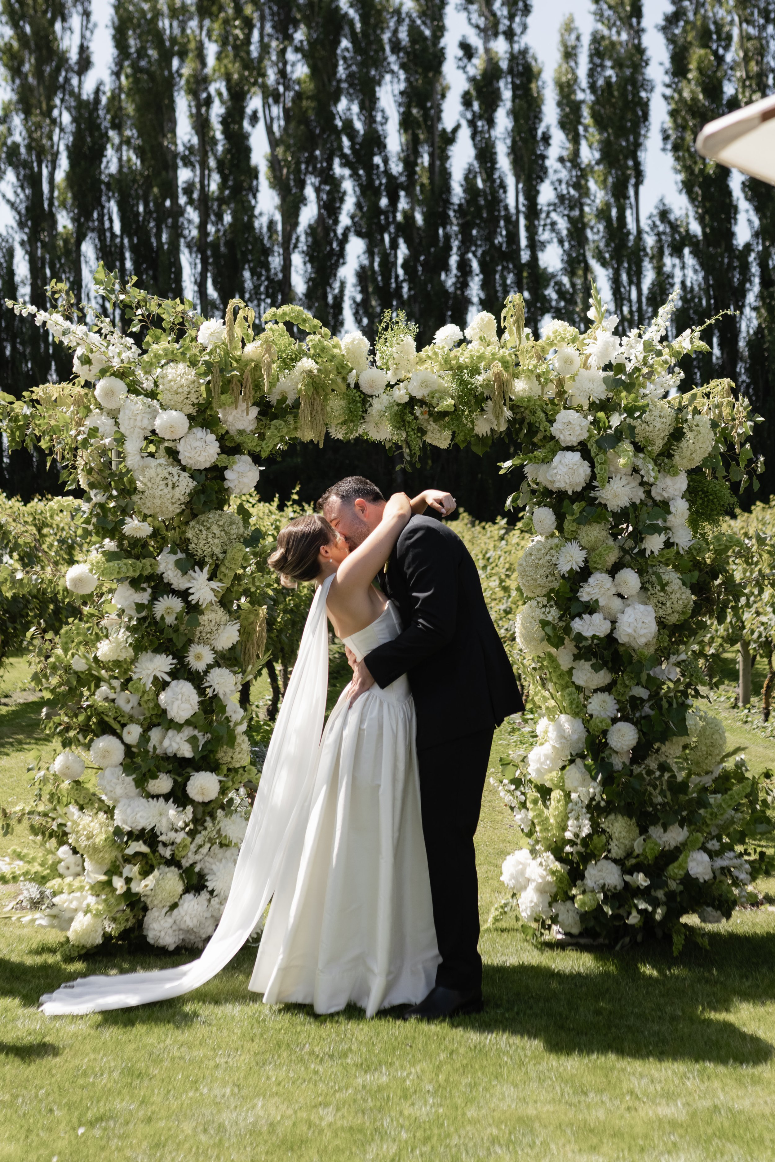 White and green wedding arch at Cossars Wine Shed Christchurch