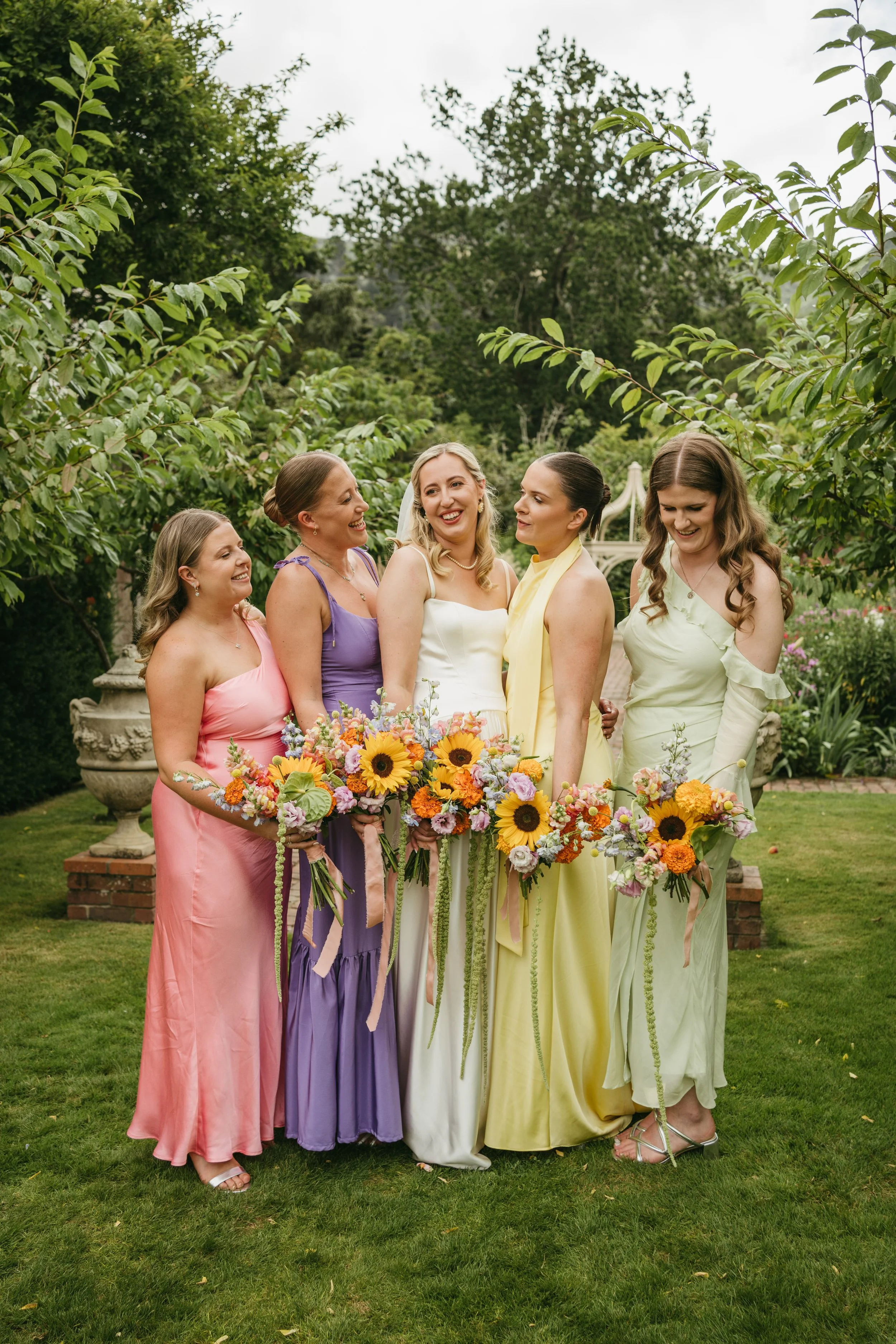 Bright 70's themed wedding bouquets with sunflowers