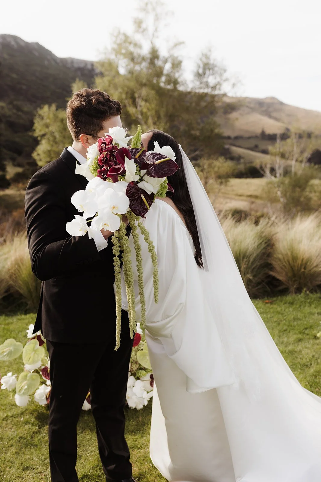 Dark red white and green wedding bouquet