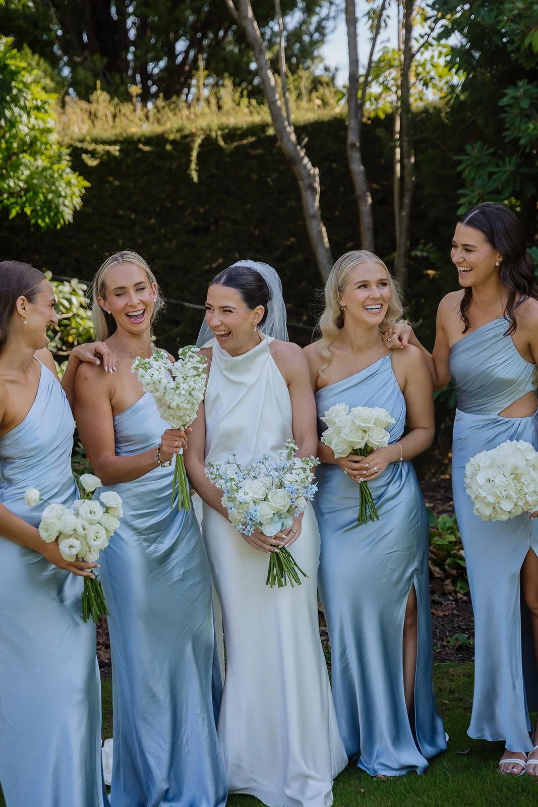on mass bridesmaids bouquets blue and white wedding