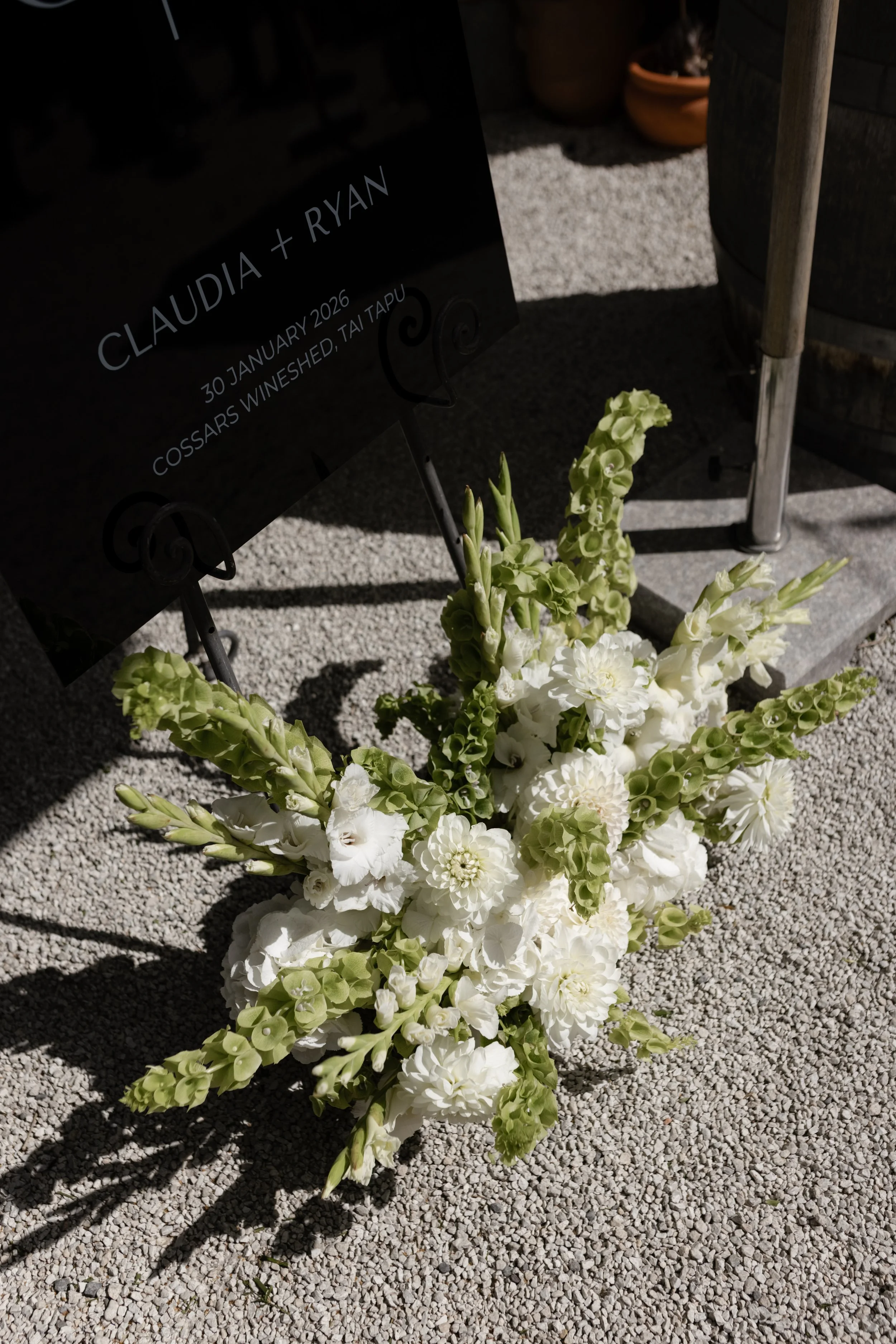 White and green wedding welcome sign flowers