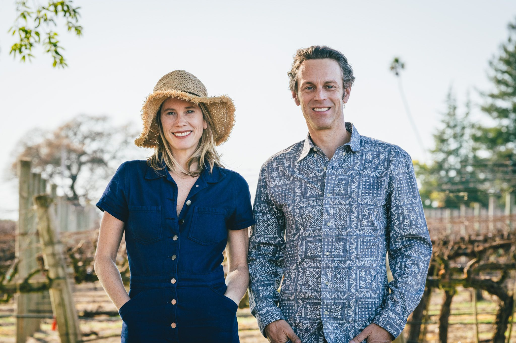 Sara and Matt Licklider standing in the vineyard