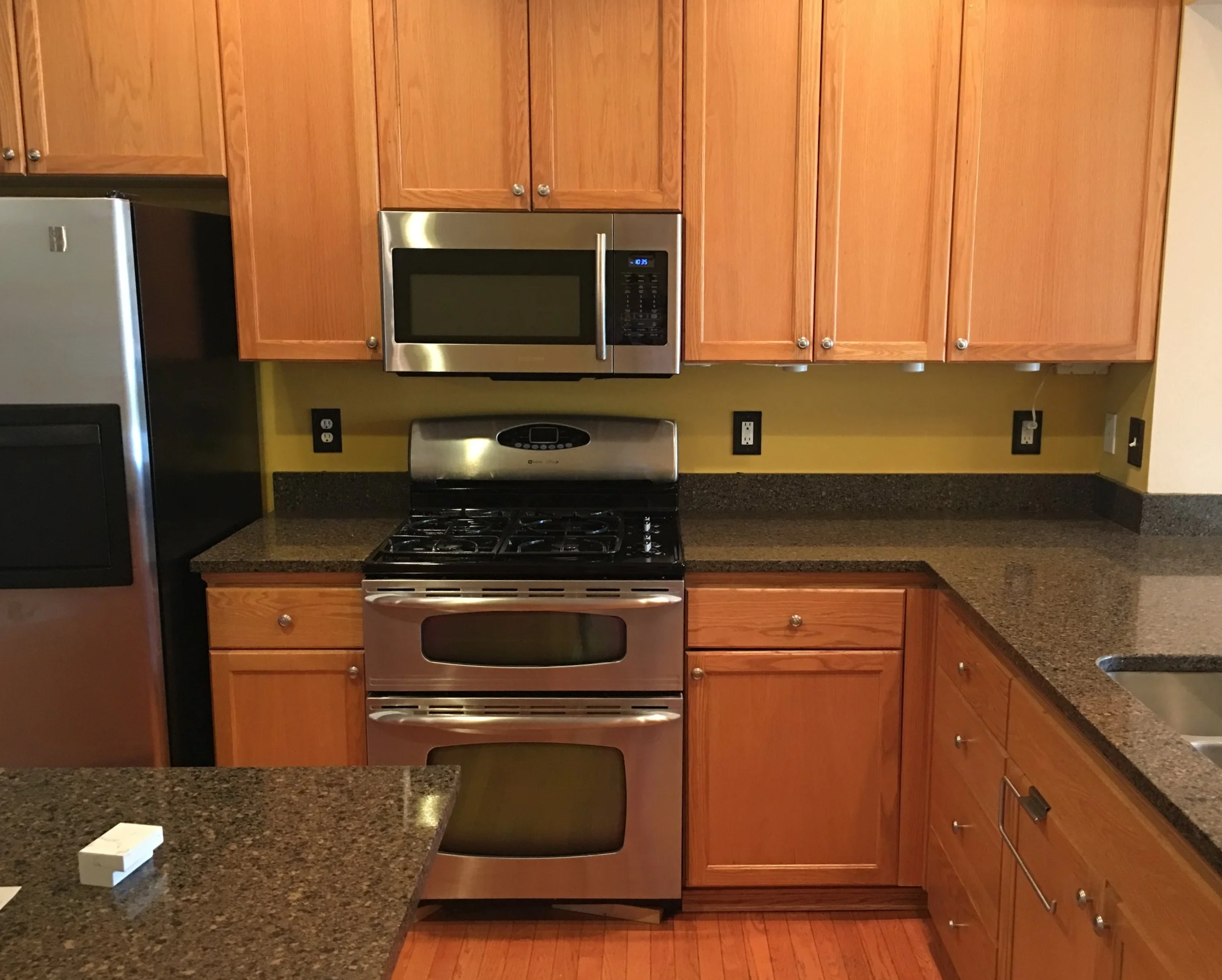Kitchen with wooden cabinets.