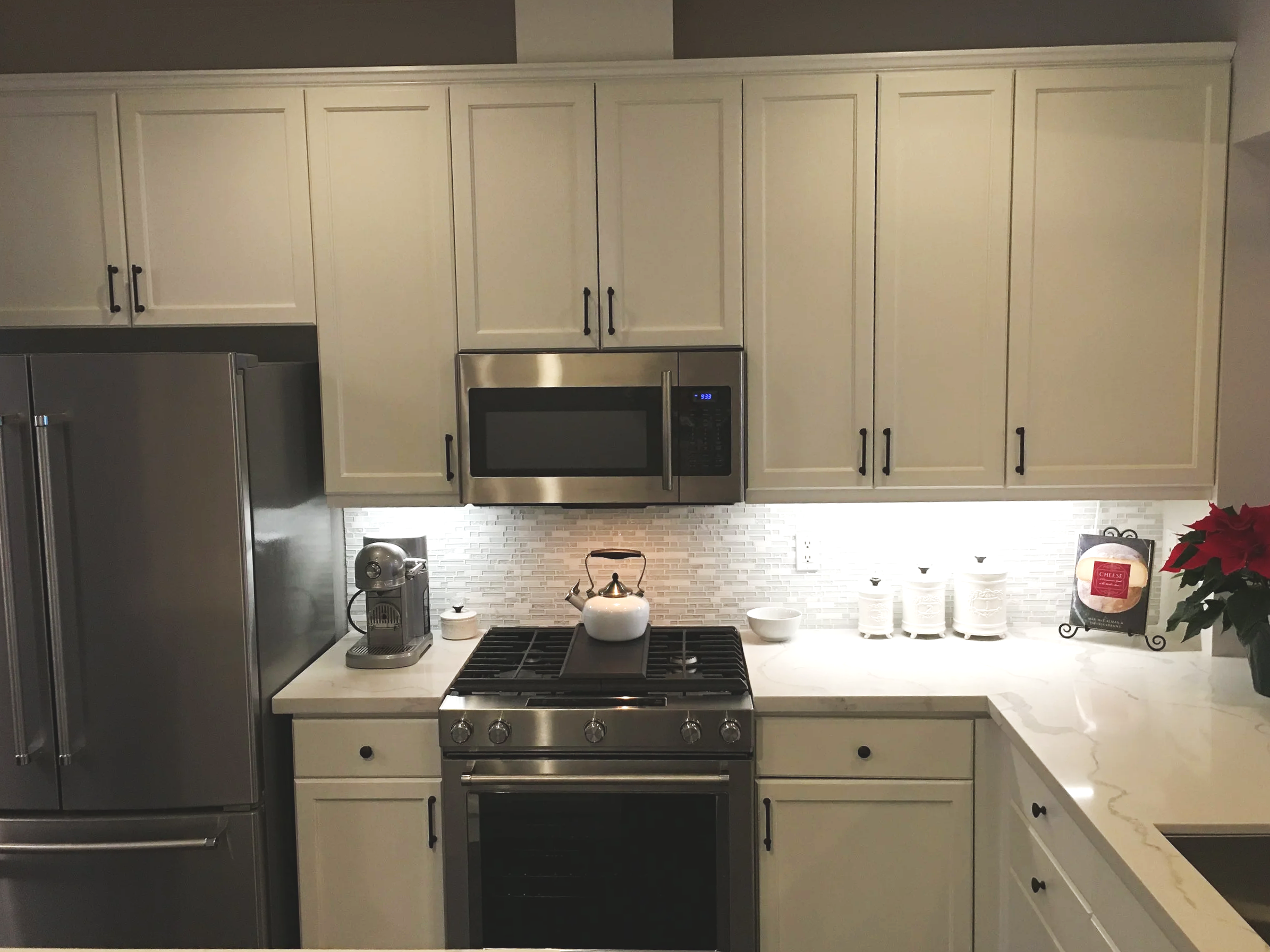 Modern kitchen with white cabinets.
