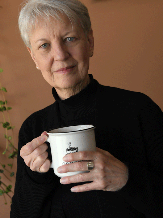 Photo of Shirley Hilton holding a coffee mug.