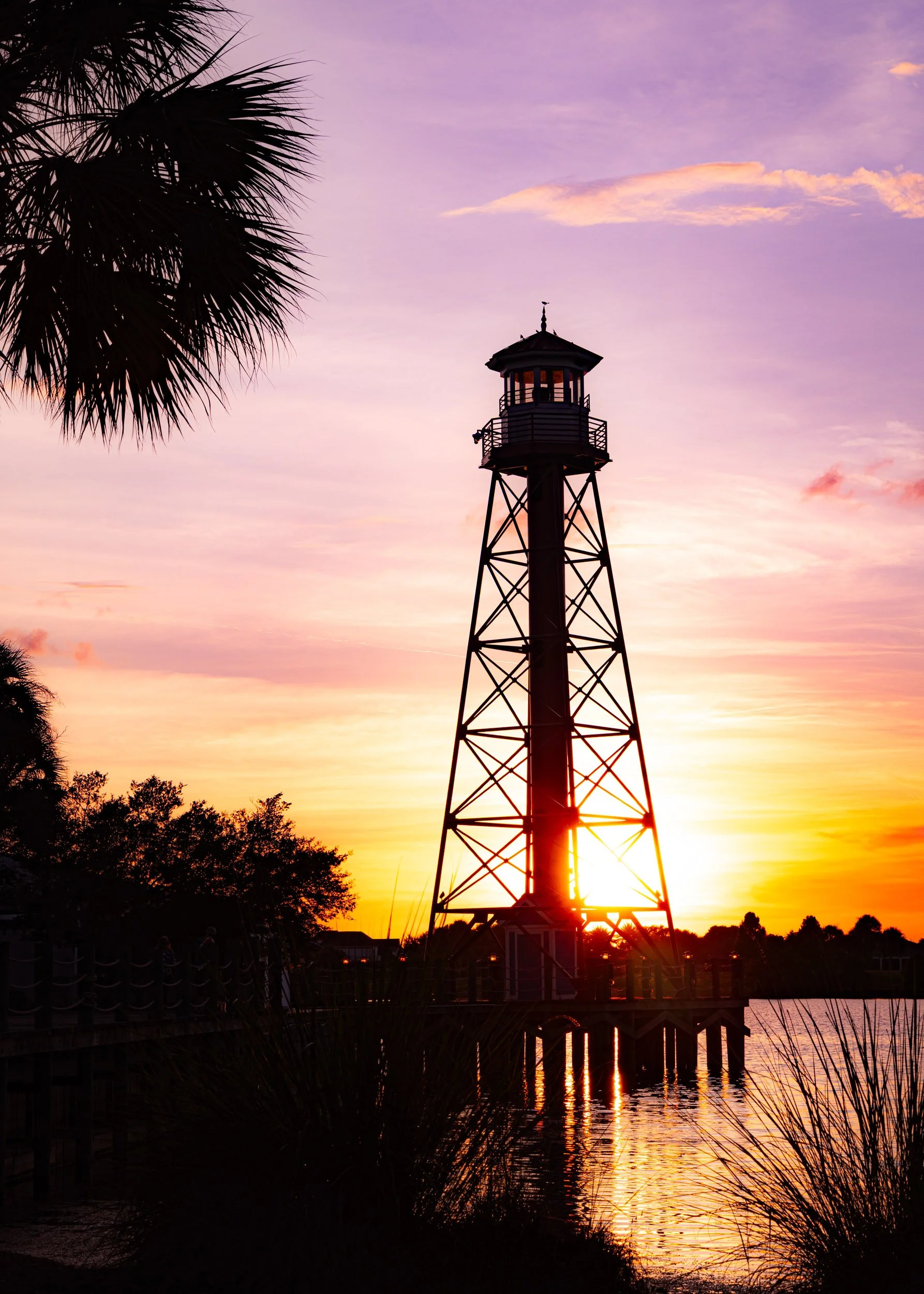 florida-lighthouse-sunset-vibrant-purple-sky-lake-sumter-landing-the-villages.jpg