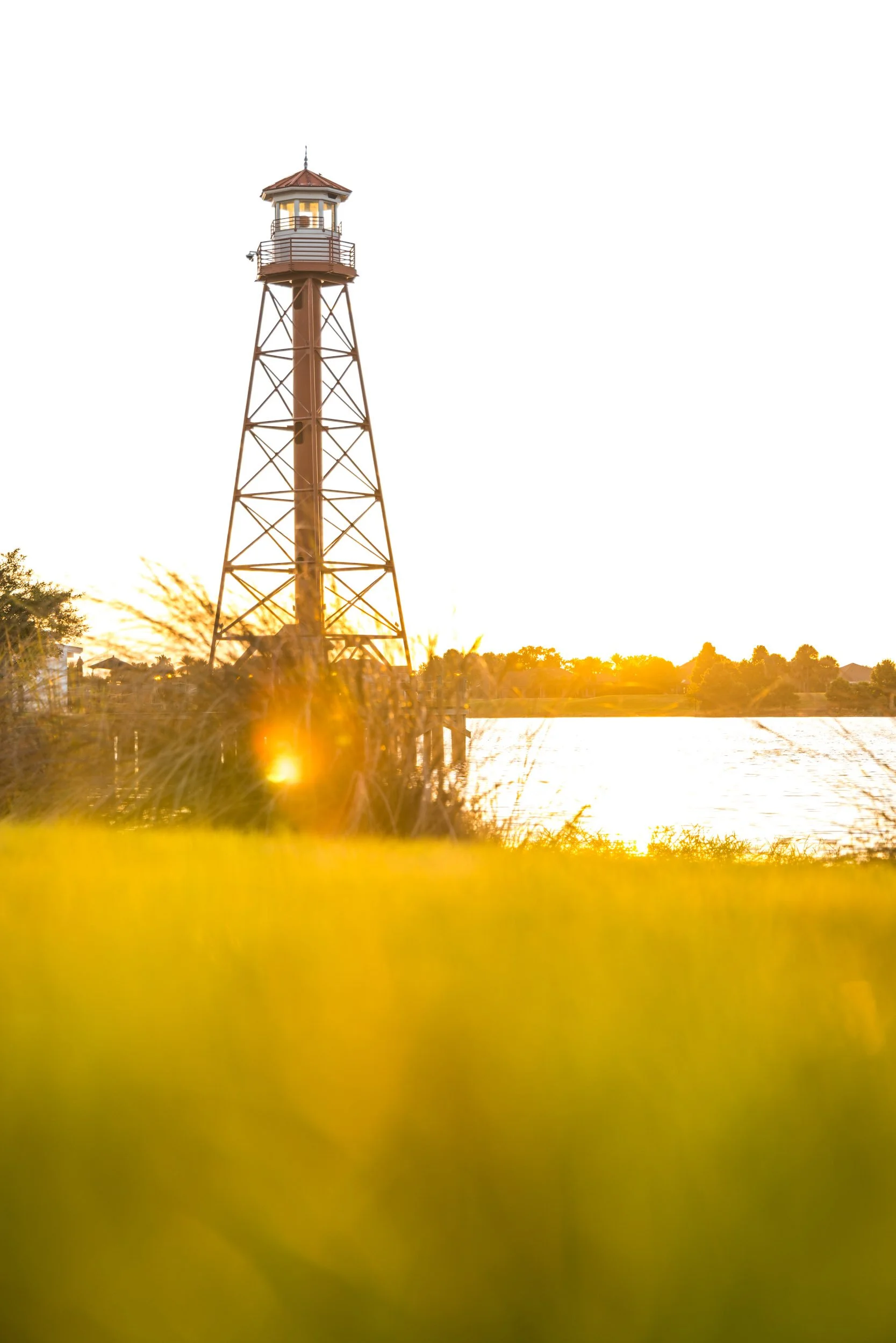 golden-hour-lighthouse-silhouette-tall-grass-lake-sumter-landing-the-villages-florida.jpg