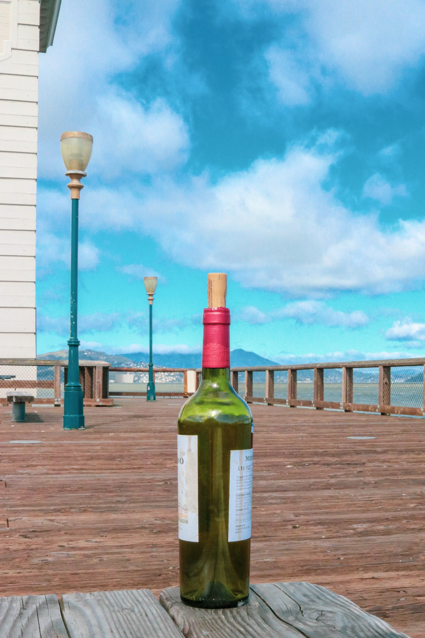 wine-bottle-on-wooden-pier-san-francisco-bay.jpg
