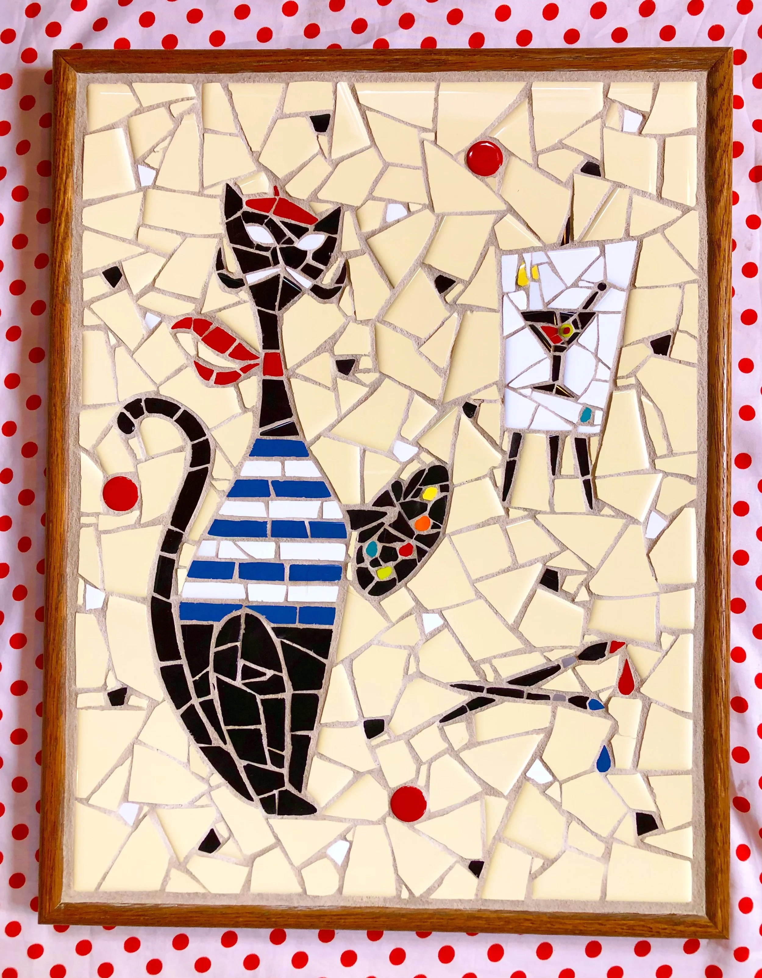Artist cat. Ceramic tiles on glass. 18"x14". 2021