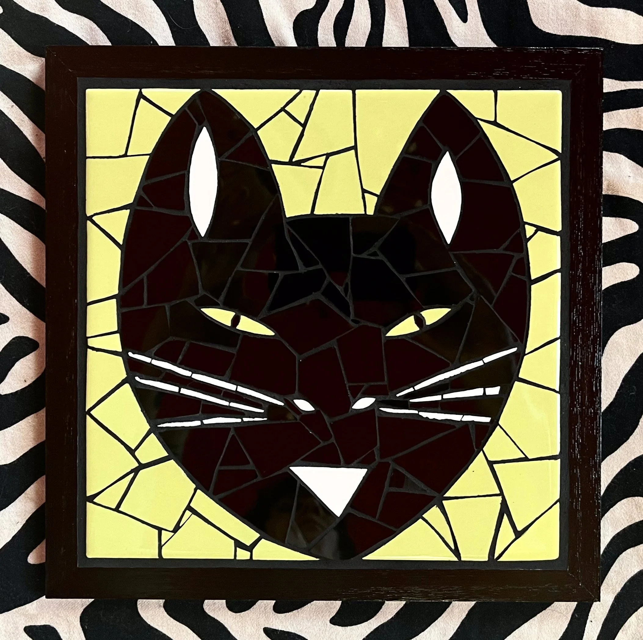 Norma cat. Ceramic tiles on wood. 10"x10". 2023