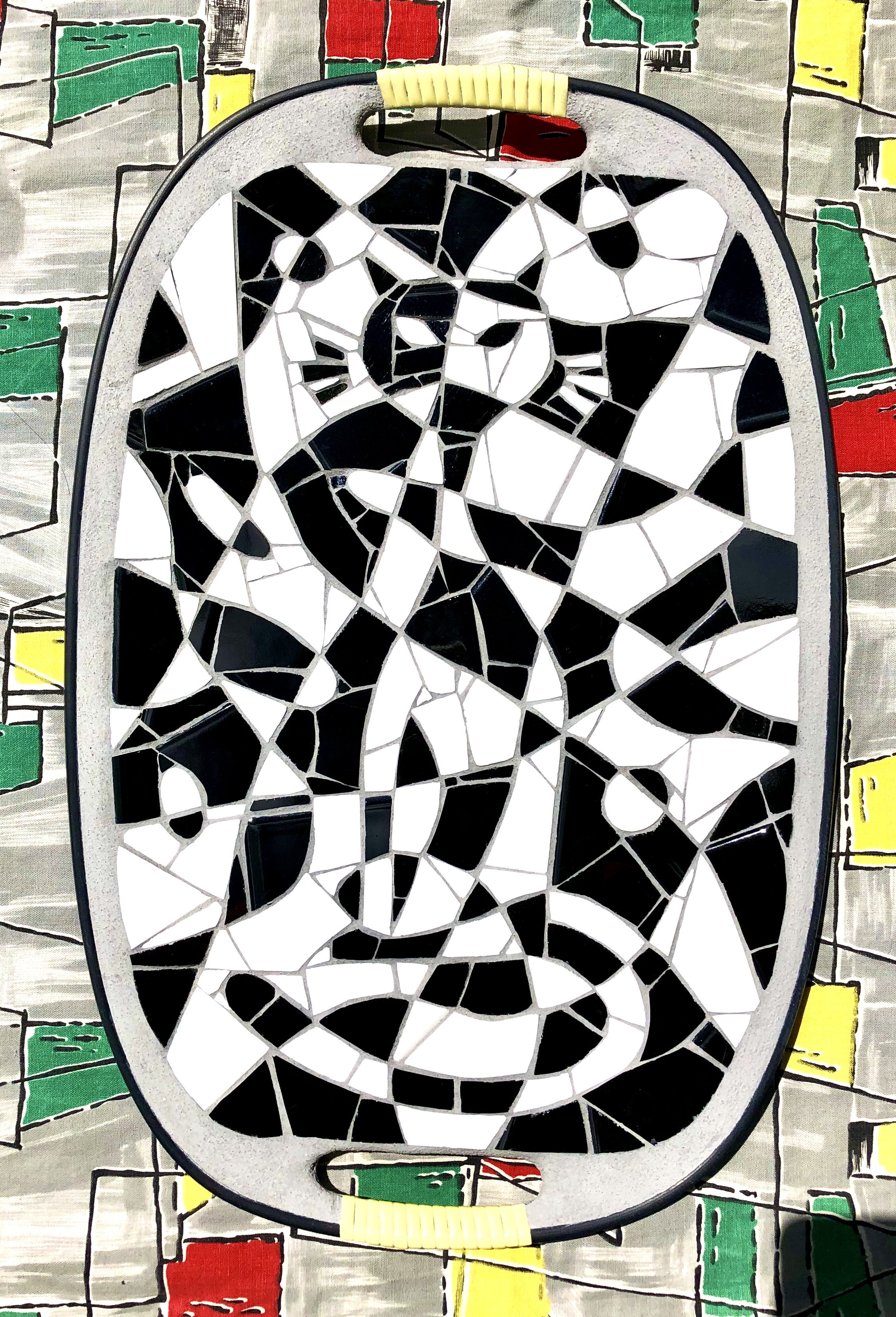Abstract cat. Ceramic tiles on Masonite tray. 18"x12". 2020