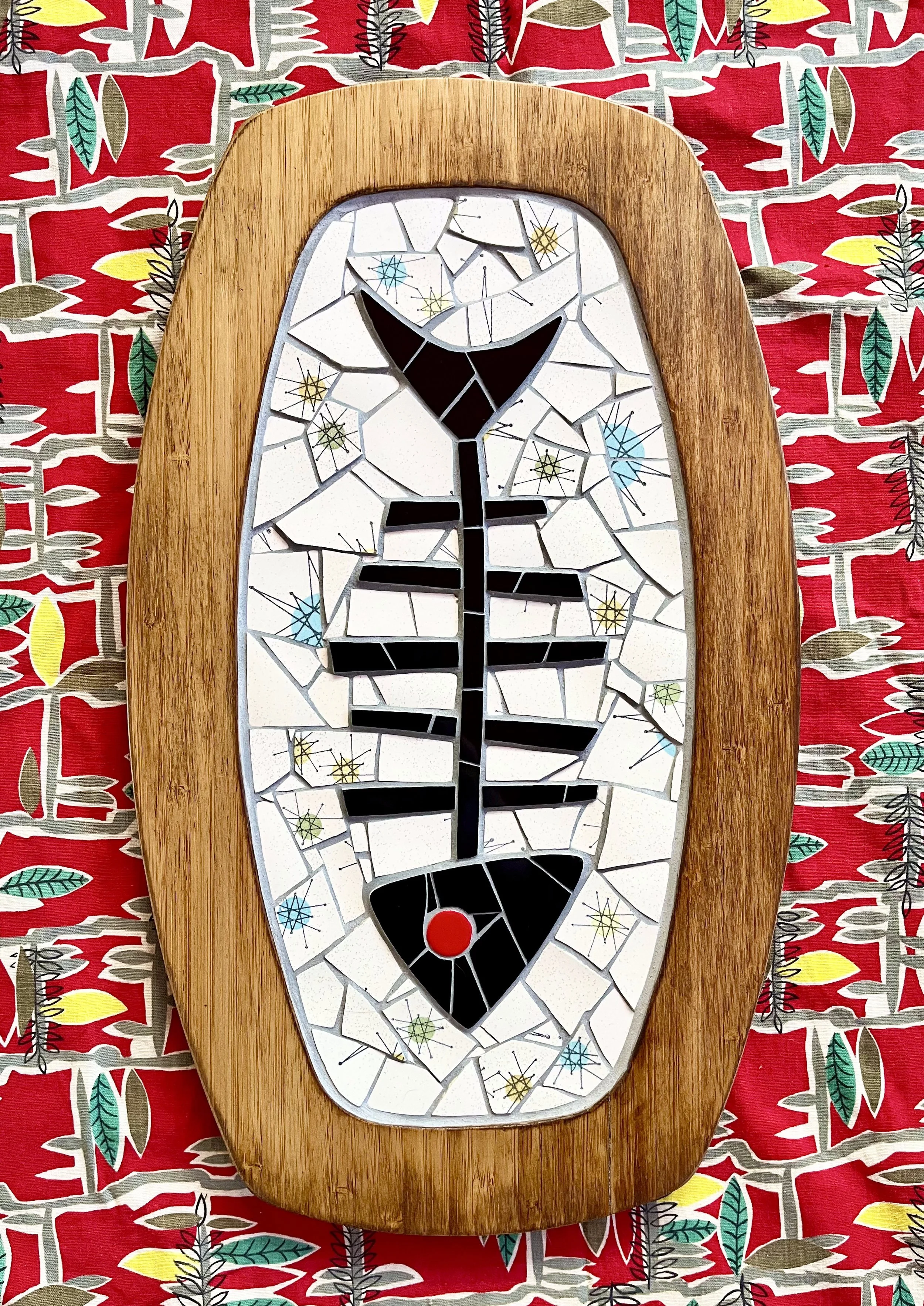 Starburst fishbone. Tiles and plates on wood. 18"x10.75". 2024