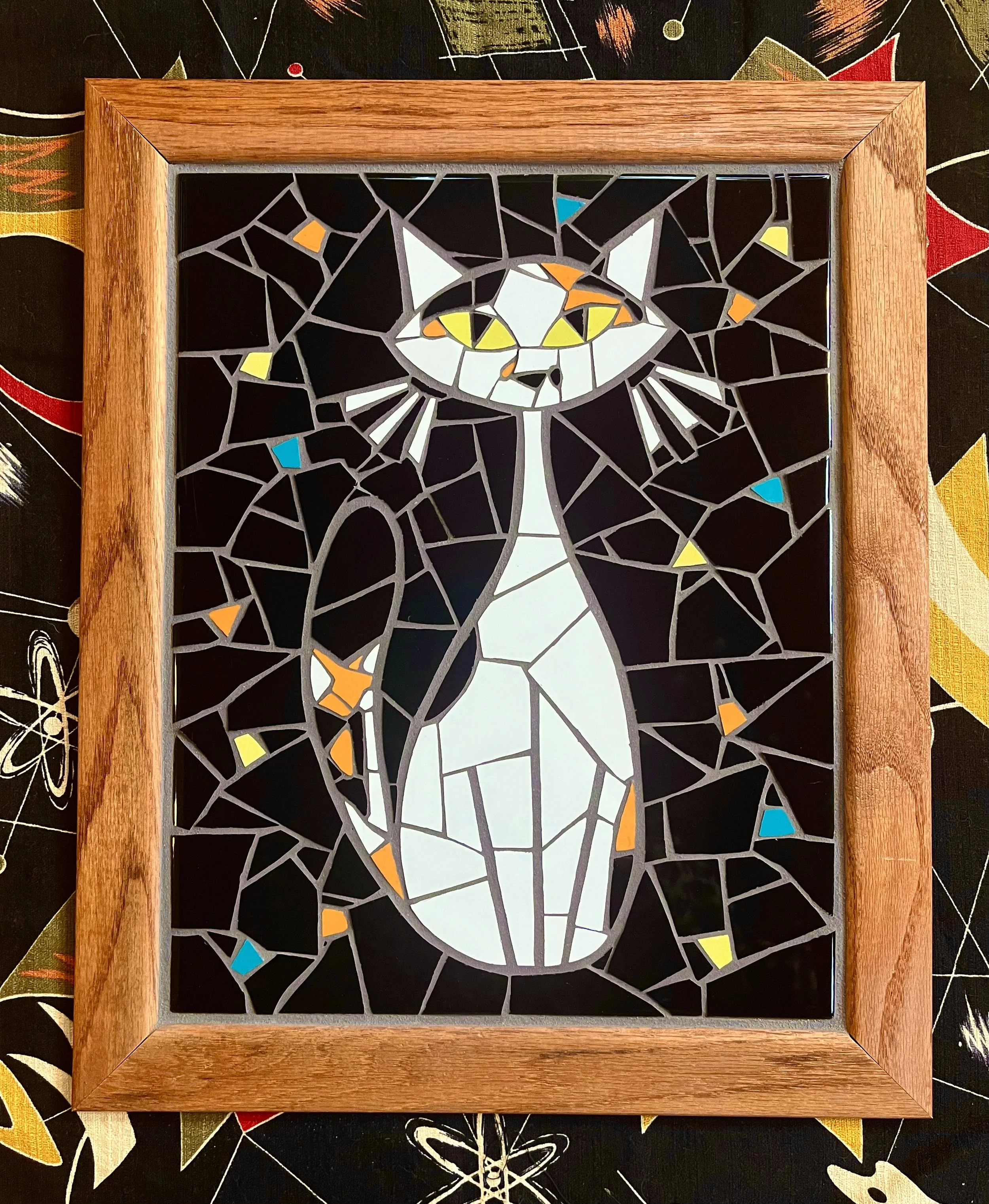 White cat commission. Ceramic tiles on wood. 15"x11". 2023