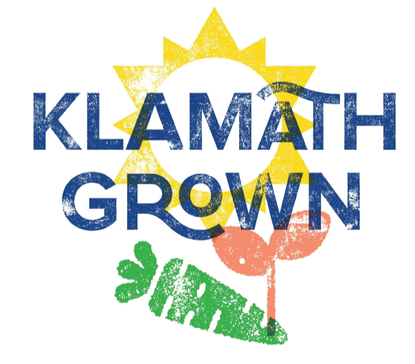 Text reading 'Klamath Grown' over a graphic of a sun and a green sprout.