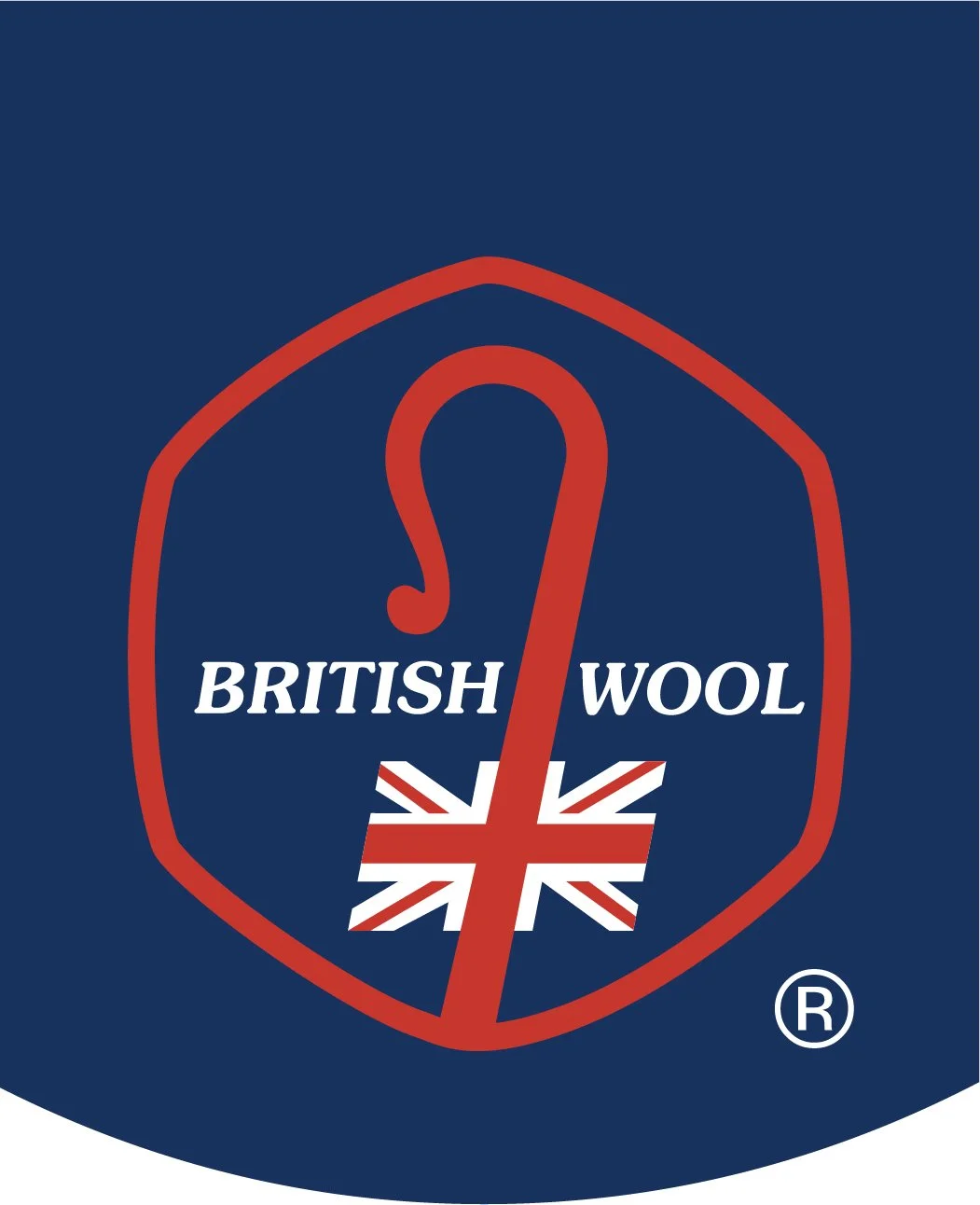 A logo for British Wool featuring a shield-shaped design with a red outline, a red sterling silver hook, and the words 'British Wool' in white text. The bottom of the shield contains a stylized British flag.