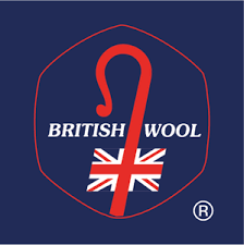 Logo of British Wool featuring a red question mark, the Union Jack, and the words 'BRITISH WOOL' on a dark blue background.