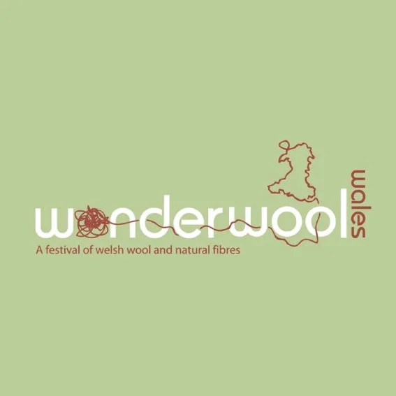 Logo for the Wonderwool Wales festival featuring a green background, a red yarn ball with a loose end, and a simple outline of Wales above it.