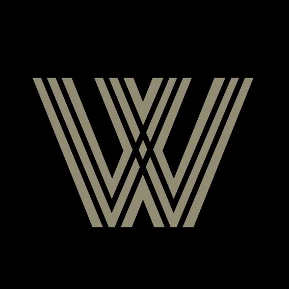 Stylized gray letter W on a black background.
