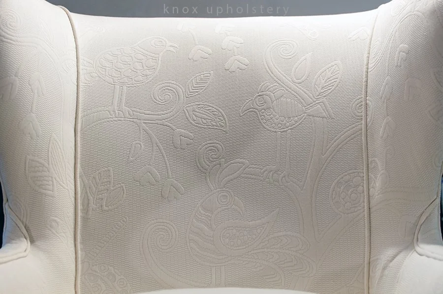 white-fabric-wingback-chair.jpg