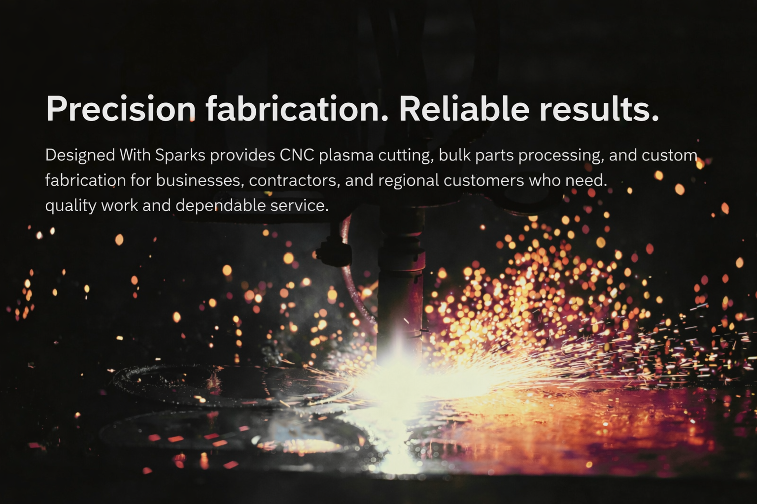 A welding torch sparks as it cuts through metal with bright light and sparks flying in dark surroundings.